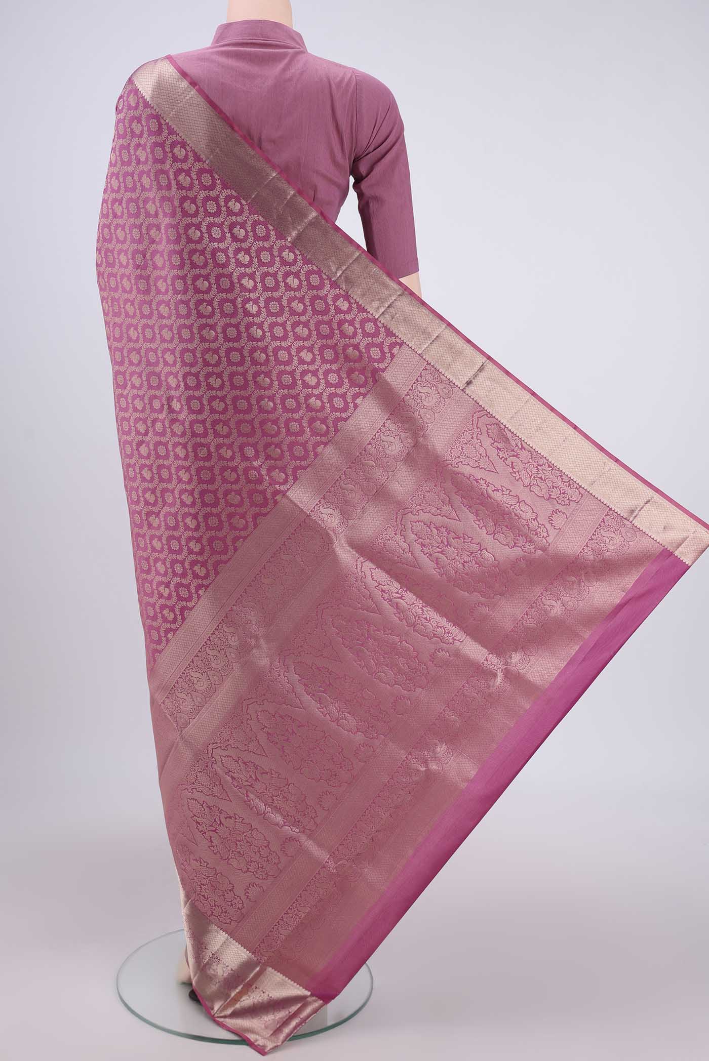 Flat view of Rose Gold Dual Tone Soft Silk Saree with Zari Brocade on the body and Zari Border. 