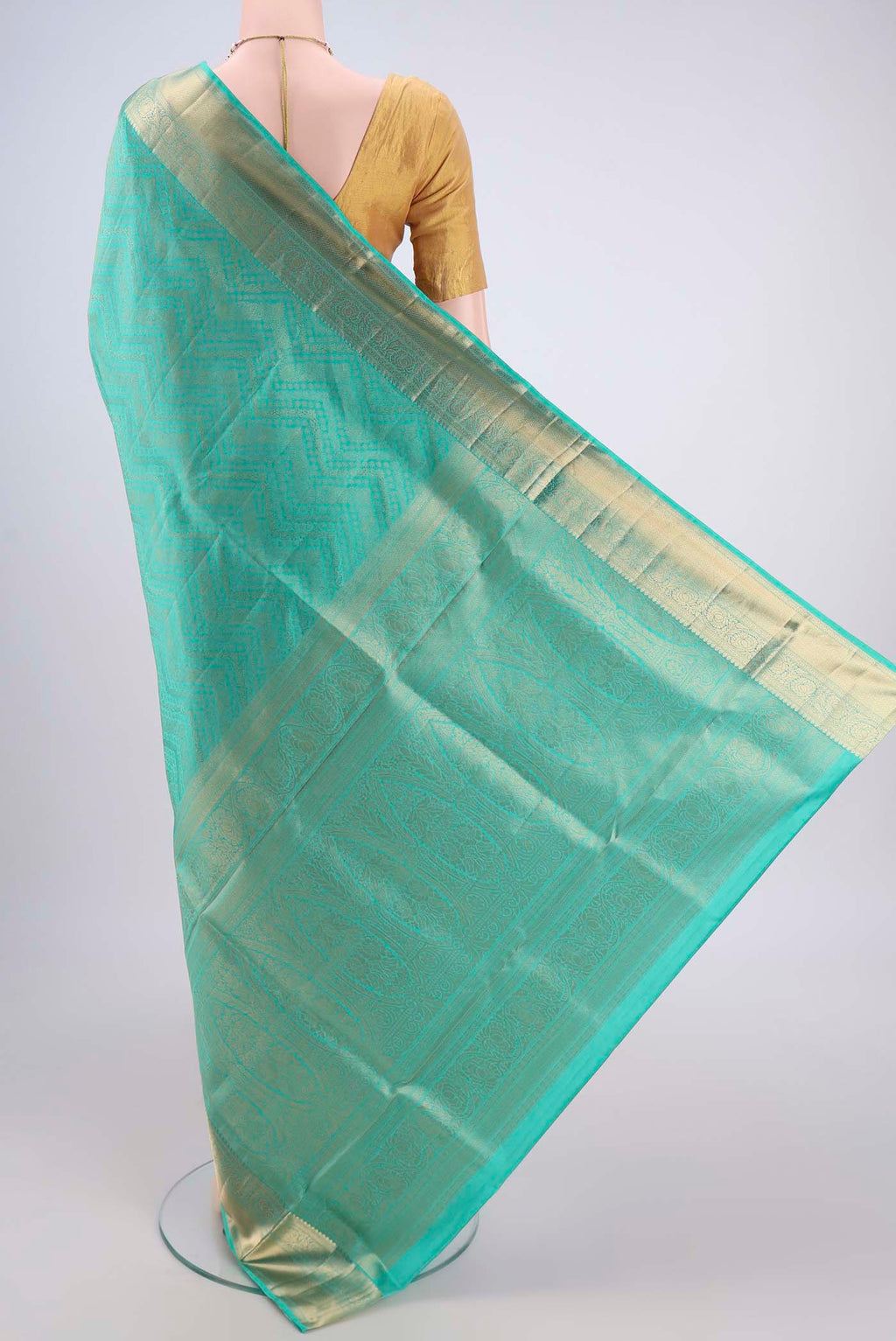 Flat view of Sea Green Soft Silk Saree with Zari Brocade on the body and Zari Border. 
