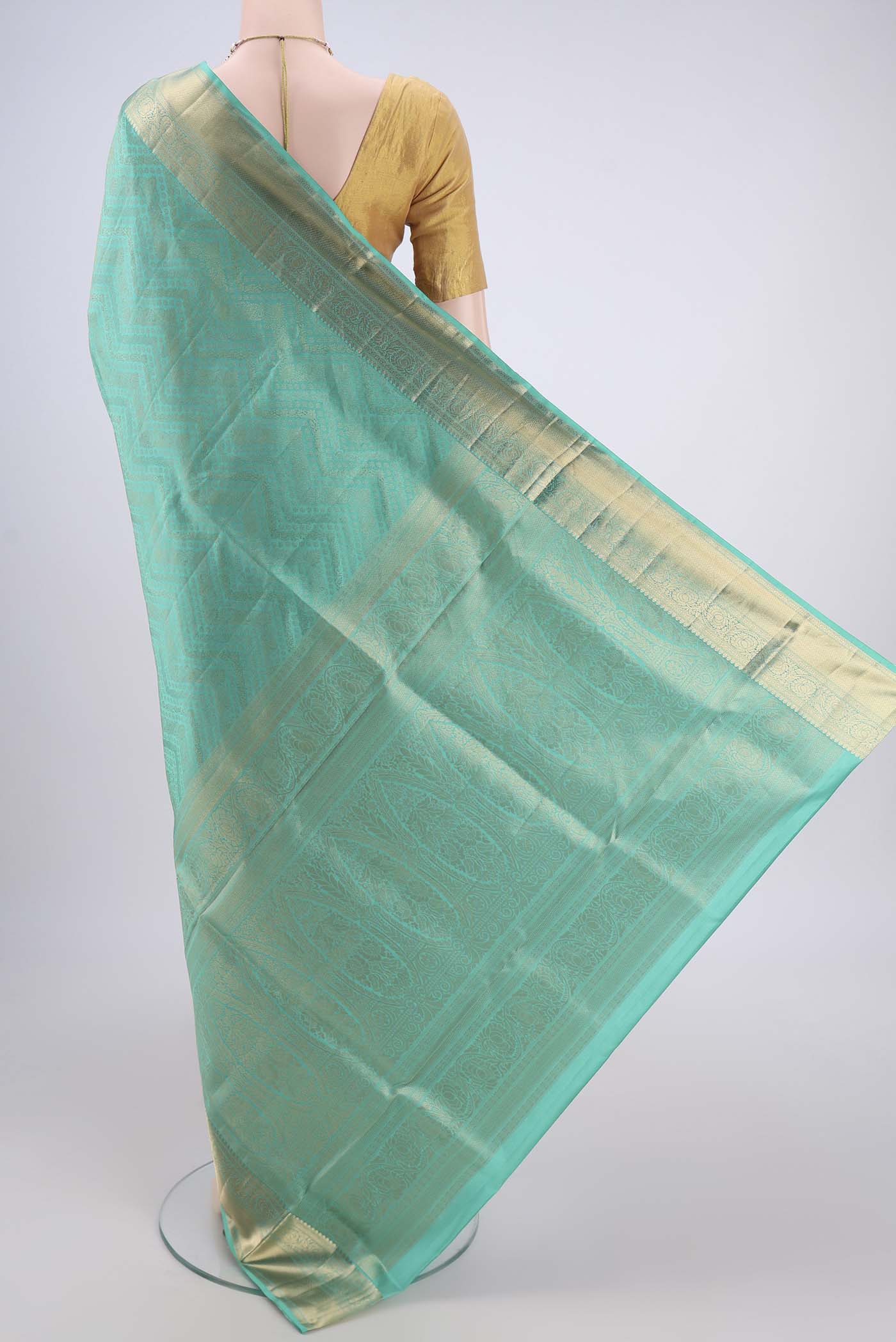 Flat view of Sea Green Soft Silk Saree with Zari Brocade on the body and Zari Border. 