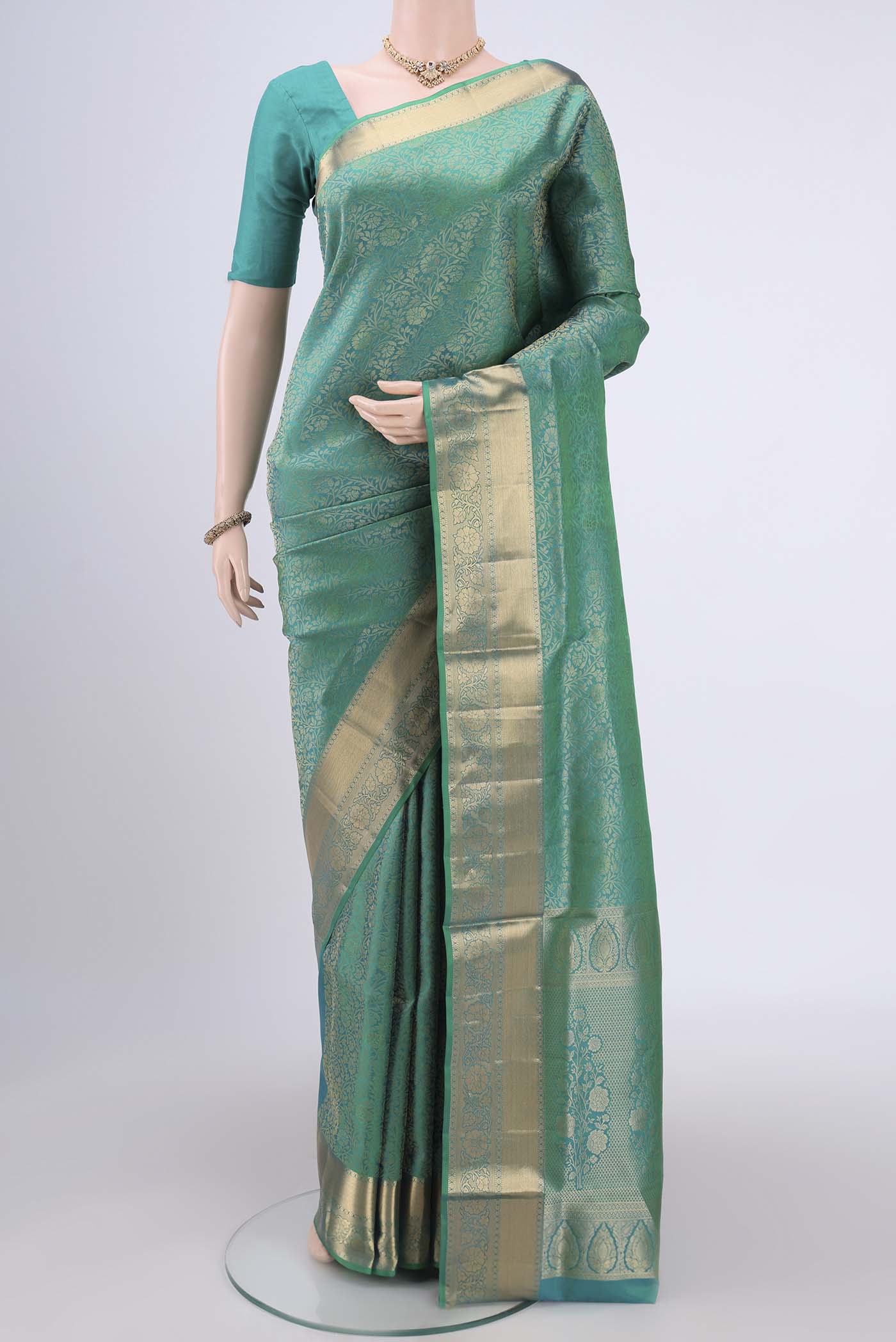 Sea Green Dual Tone Soft Silk Saree with Zari Brocade on the body and Zari Border.  displayed on a mannequin