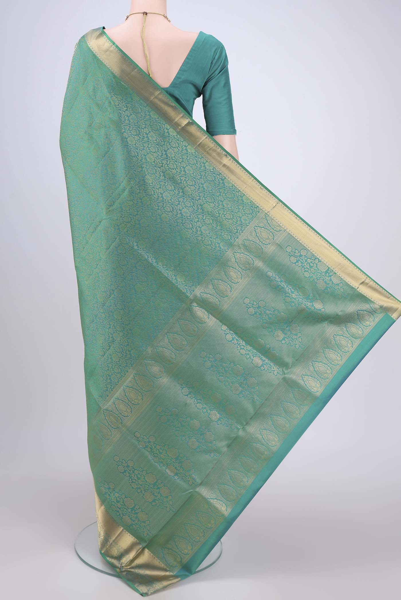 Flat view of Sea Green Dual Tone Soft Silk Saree with Zari Brocade on the body and Zari Border. 