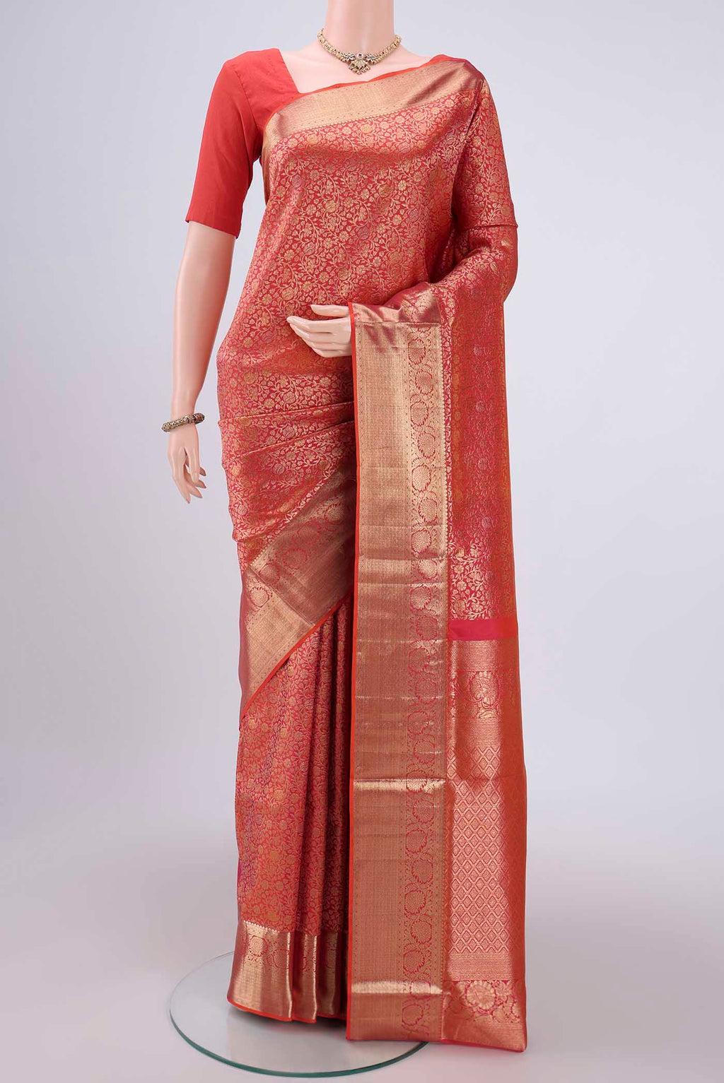 Brick Orange Dual Tone Soft Silk Saree with Zari Brocade on the body and Zari Border.  displayed on a mannequin