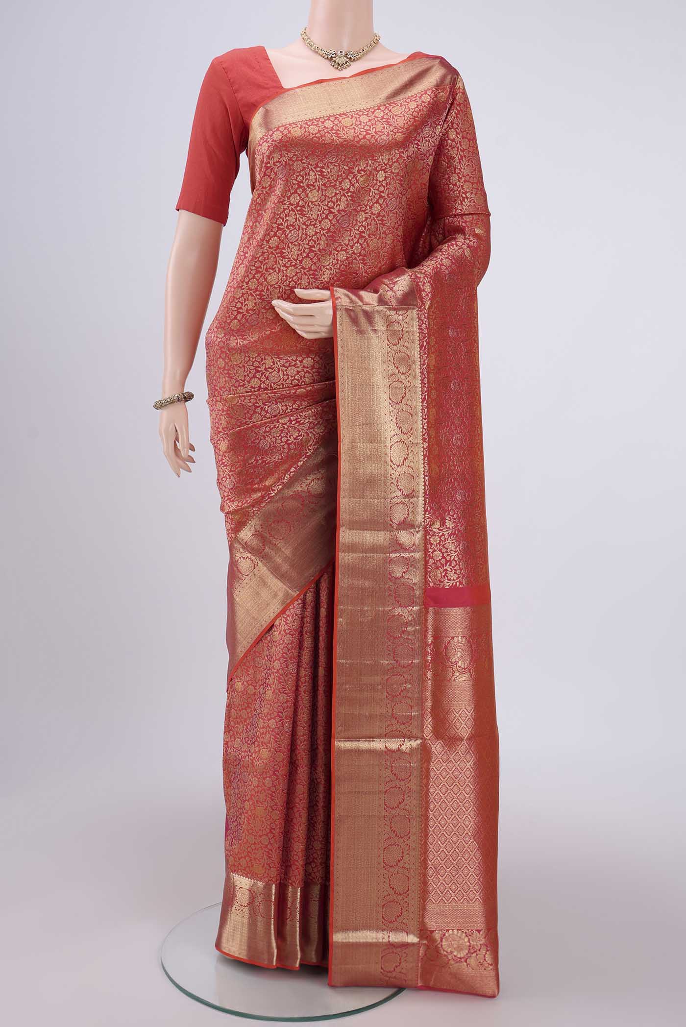Brick Orange Dual Tone Soft Silk Saree with Zari Brocade on the body and Zari Border.  displayed on a mannequin