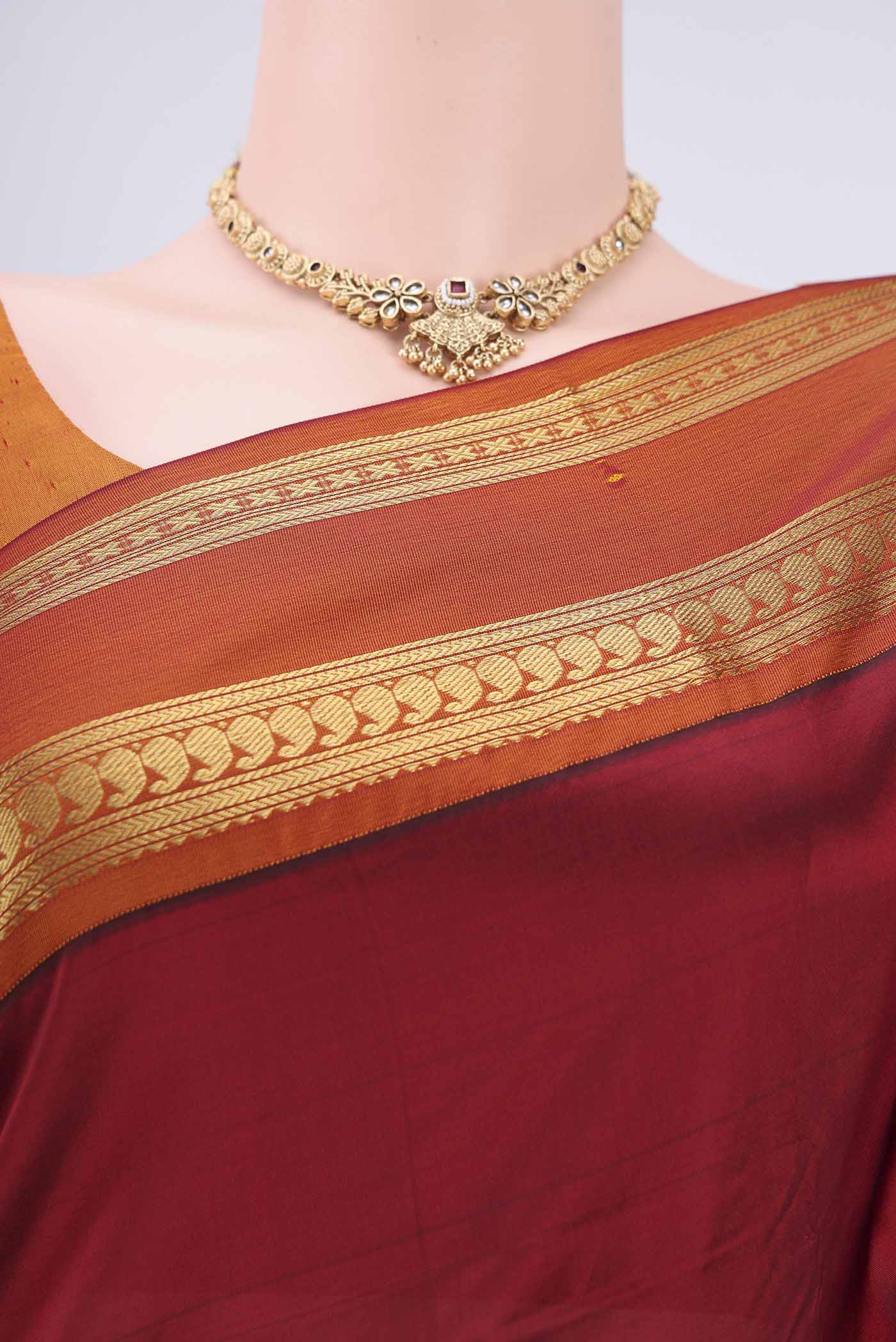 Border image of Maroon Bangalore Silk Saree with Plain Body and Zari Border. 