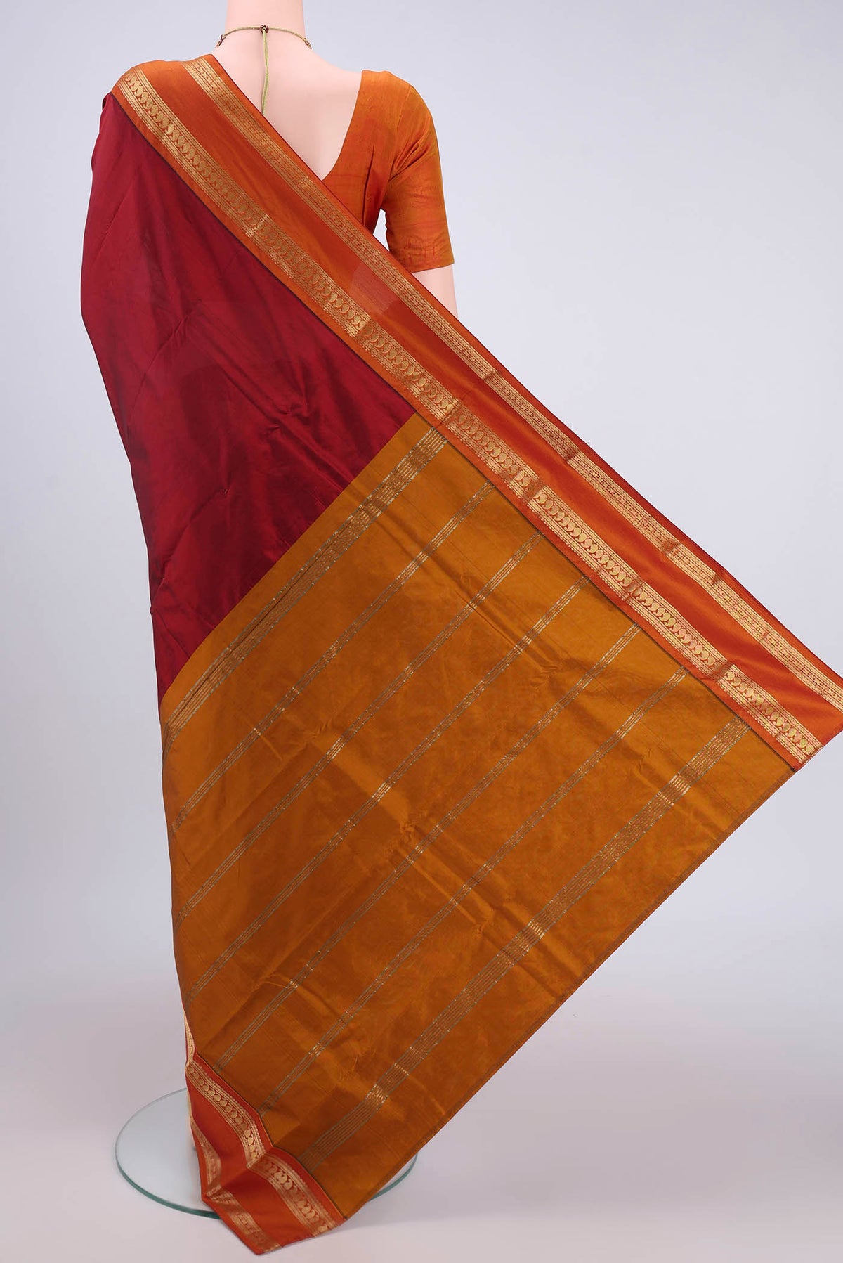 Flat view of Maroon Bangalore Silk Saree with Plain Body and Zari Border. 