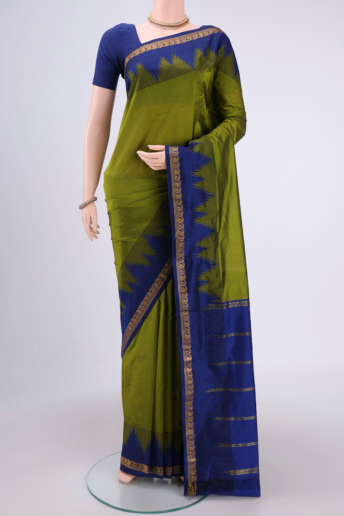Mehandi Green Bangalore Silk Saree with Plain Body and Temple Border.  displayed on a mannequin