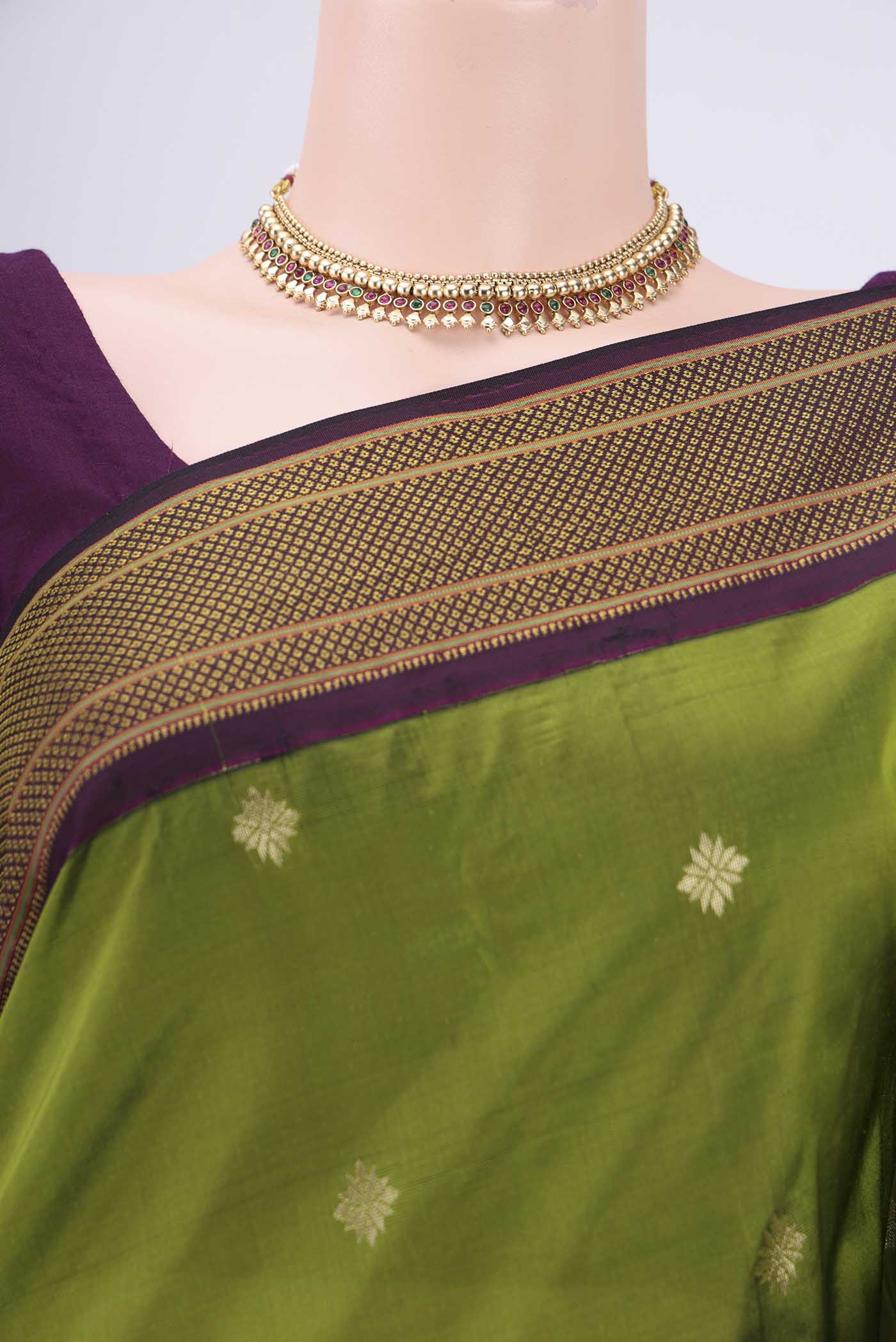 Border image of Green Blended Bangalore Silk Saree with Zari Butta on the body and Zari Border. 