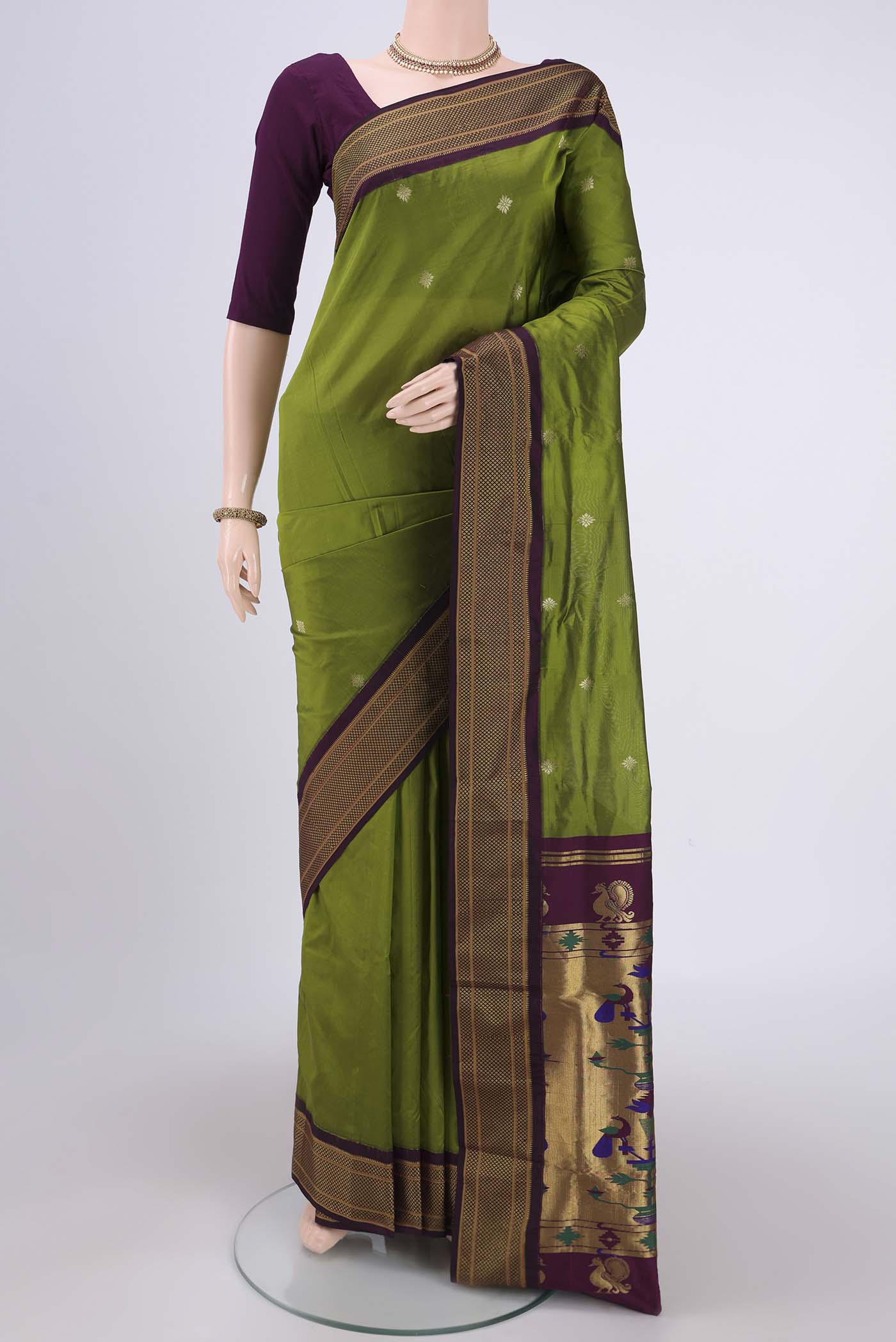 Green Blended Bangalore Silk Saree with Zari Butta on the body and Zari Border.  displayed on a mannequin