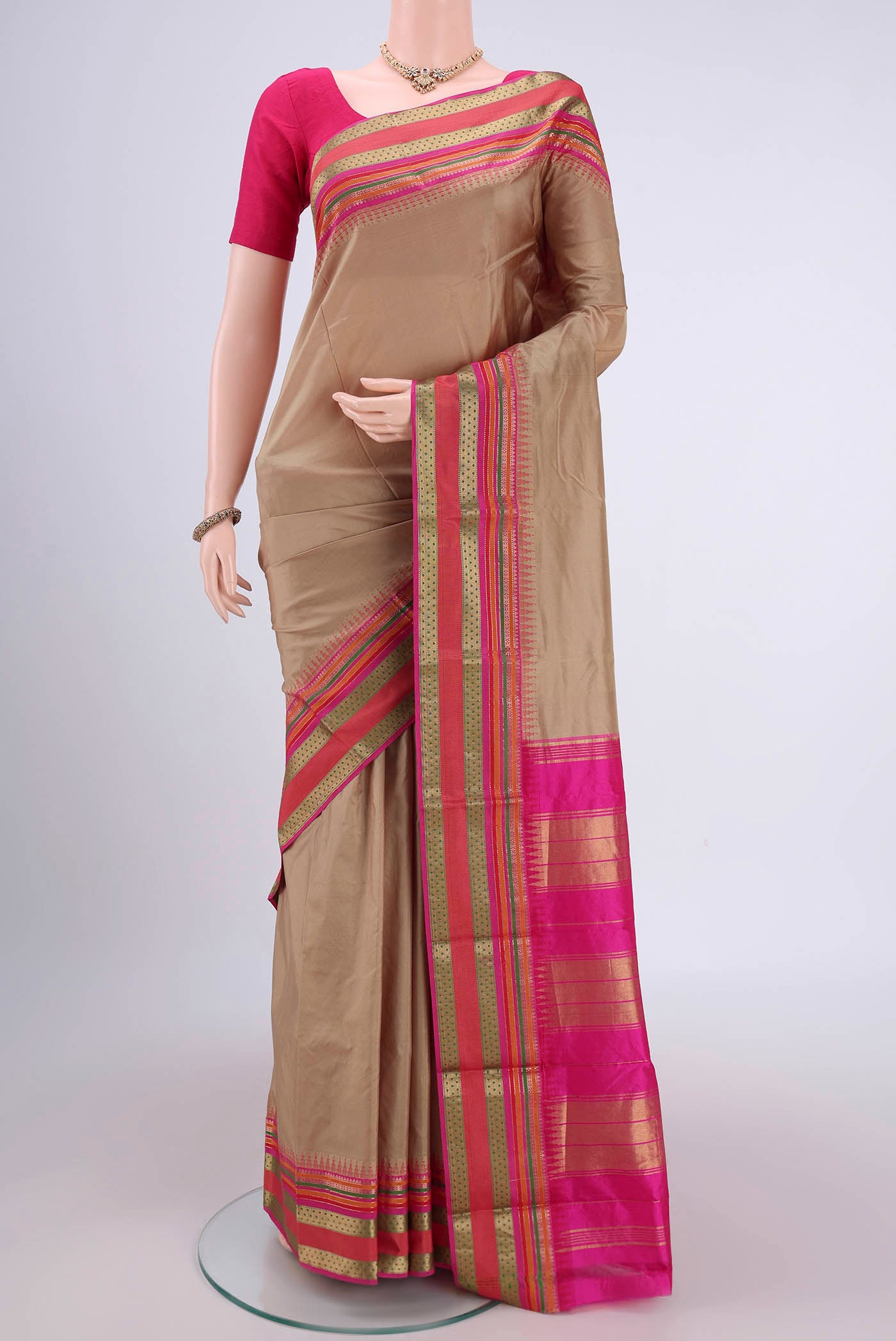 Dark Beige Bangalore Silk - kadyal Saree with Plain Body and Zari Border.  displayed on a mannequin