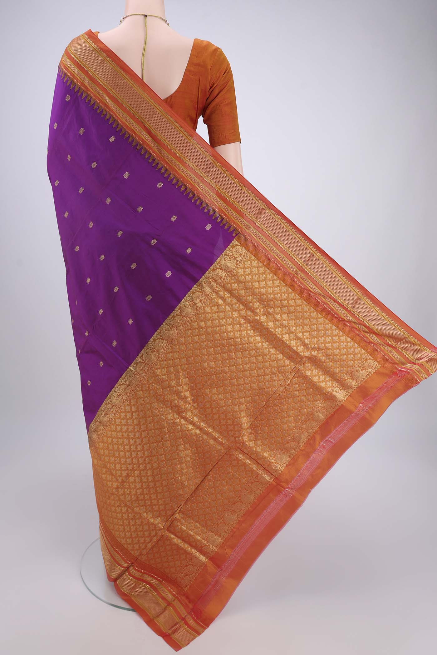 Flat view of Magenta Bangalore Silk - kadyal Saree with Zari Butta on the body and Zari Border. 