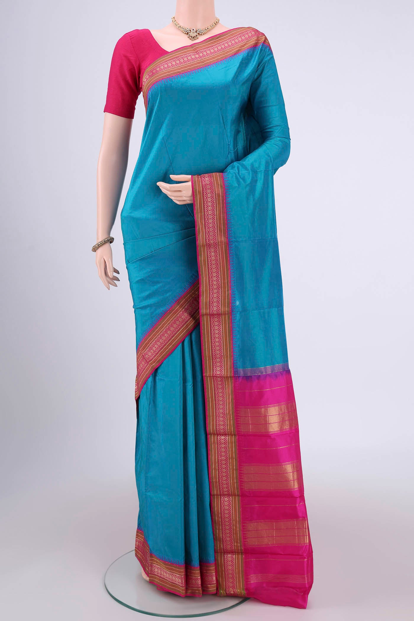 Sea Green Bangalore Silk - kadyal Saree with Plain Body and Zari Border.  displayed on a mannequin