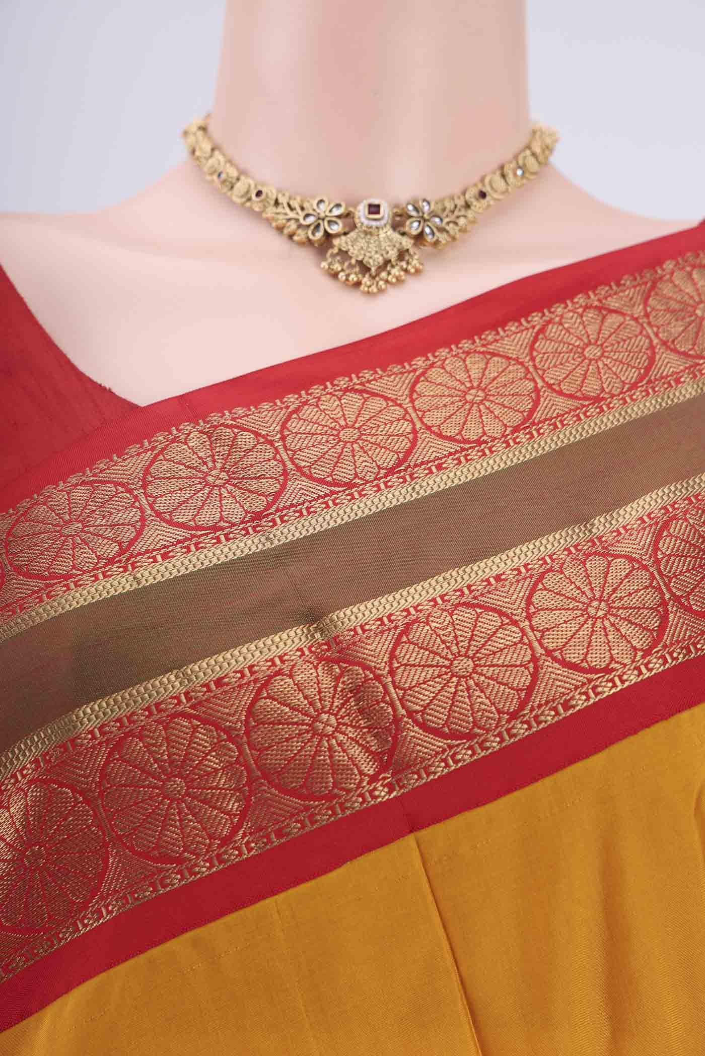Border image of Mustard Bangalore Silk Saree with Zari Butta on the body and Temple Border. 