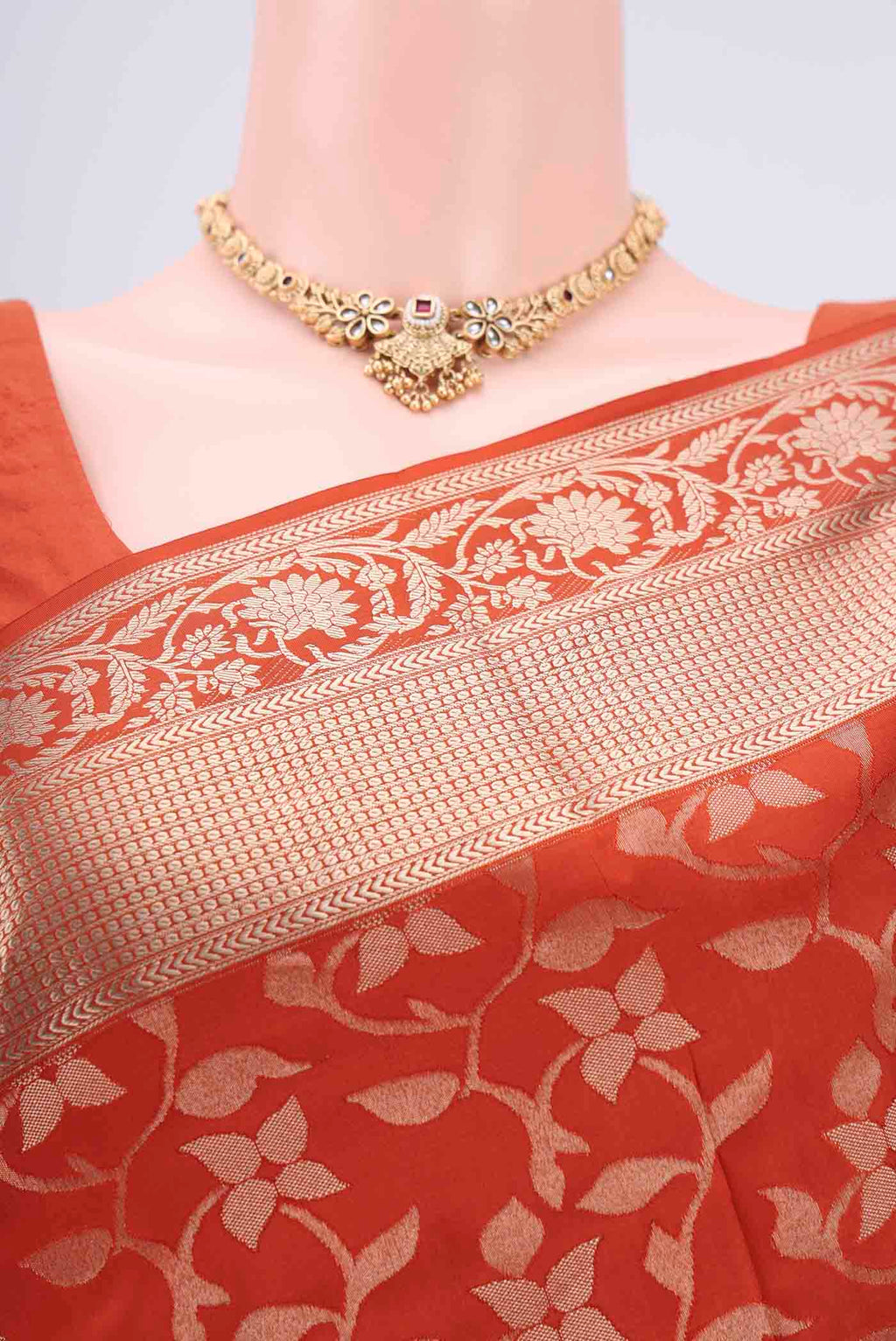 Border image of Rust Soft Silk Saree with Zari Brocade on the body and Zari Border. 