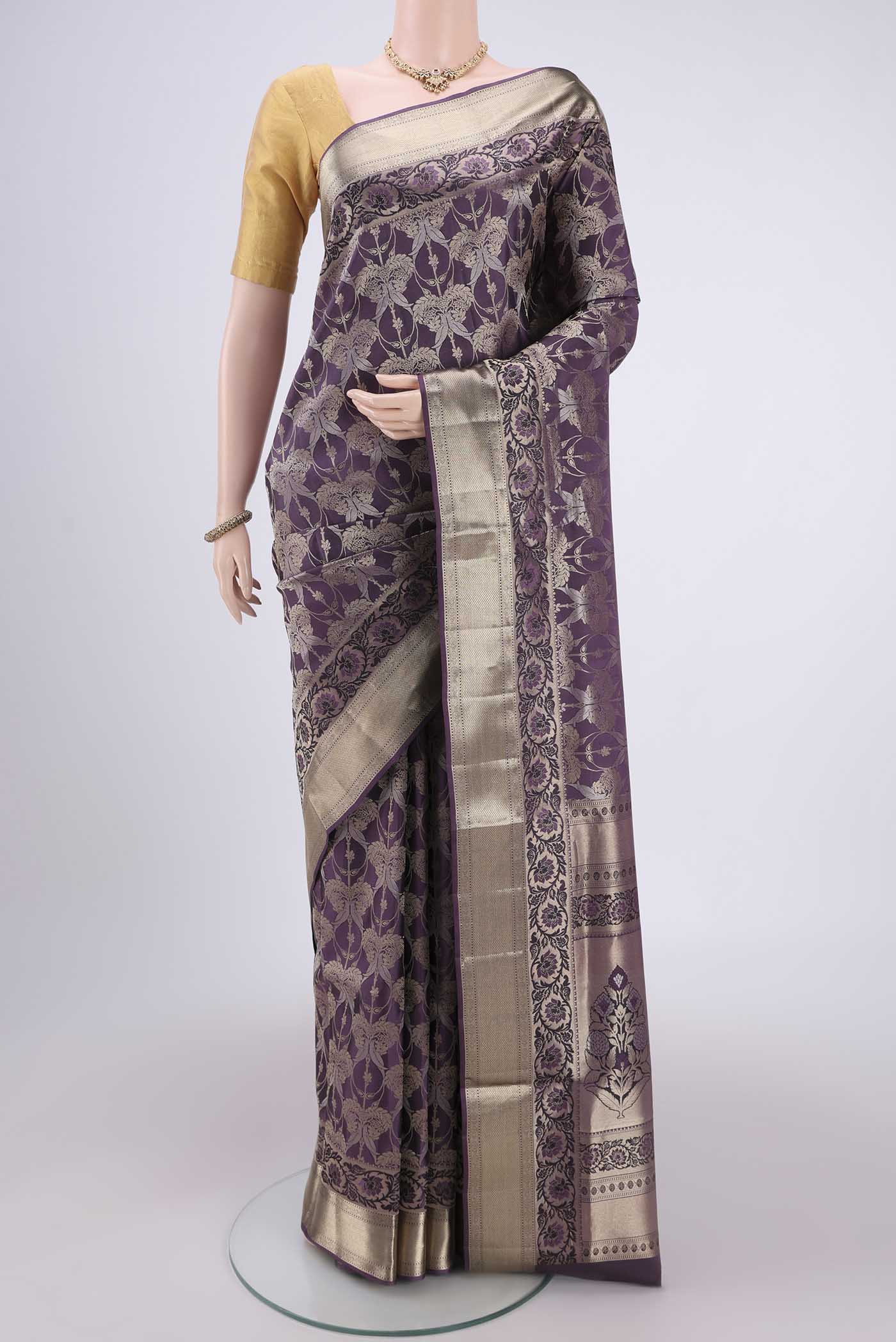 Burgundy Soft Silk Saree with Zari Brocade on the body and Zari Border.  displayed on a mannequin