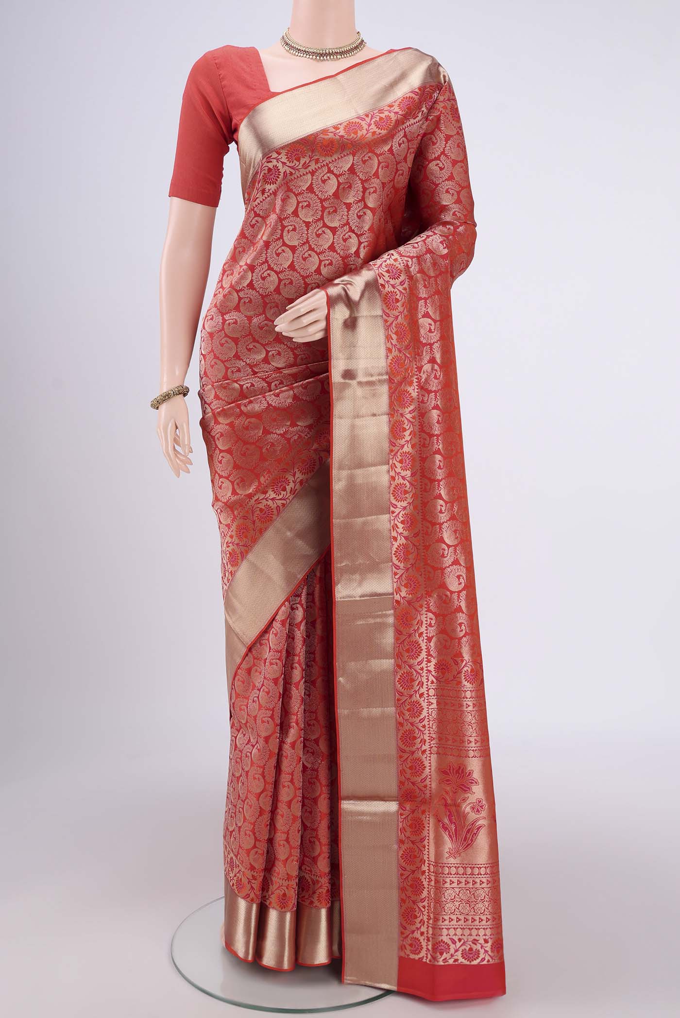 Brick Orange Dual Tone Soft Silk Saree with Zari Brocade on the body and Zari Border.  displayed on a mannequin