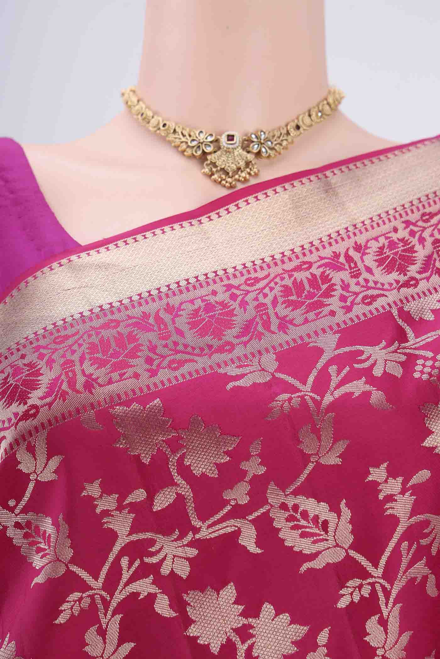 Border image of Rani Pink Soft Silk Saree with Zari Brocade on the body and Zari Border. 