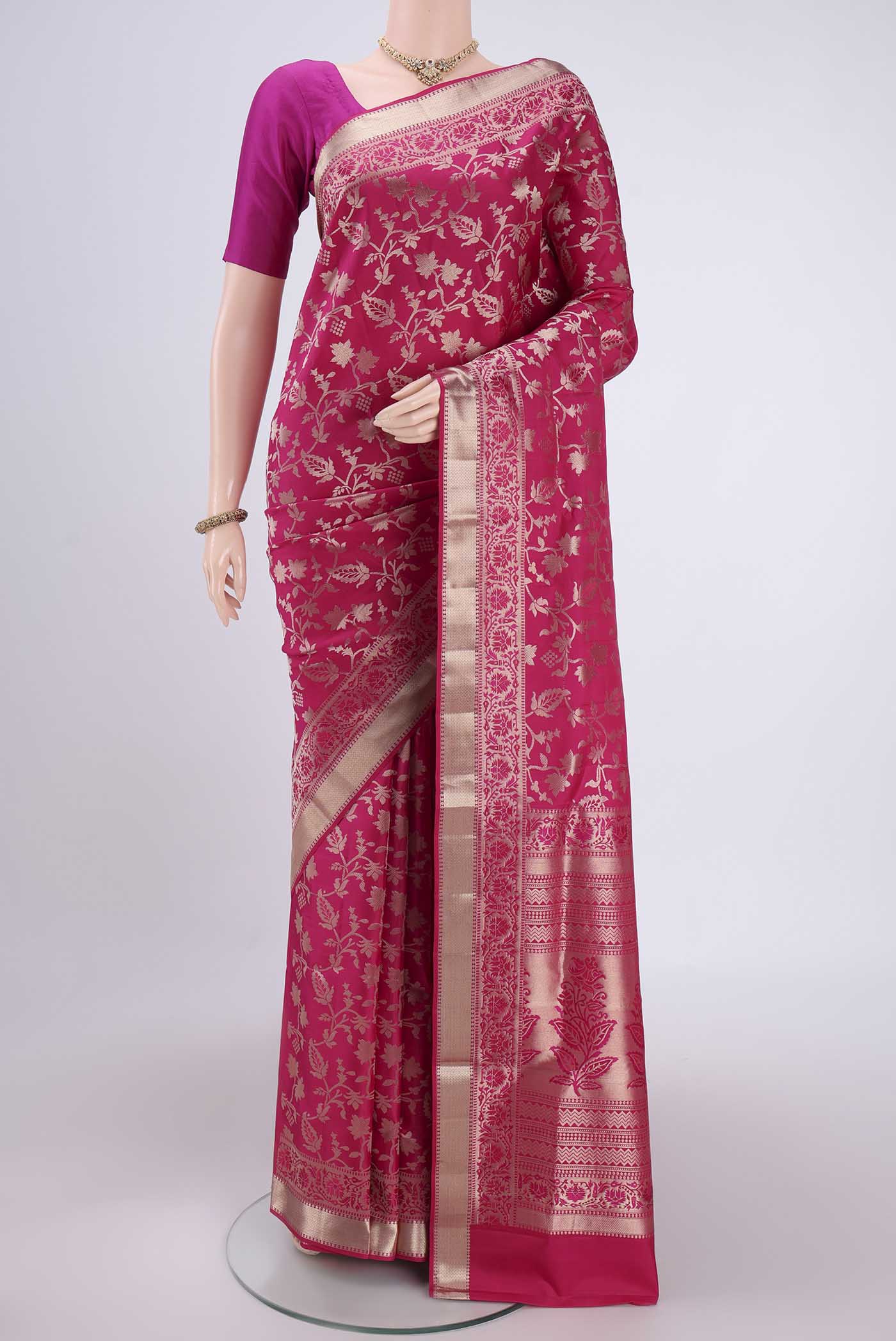 Rani Pink Soft Silk Saree with Zari Brocade on the body and Zari Border.  displayed on a mannequin