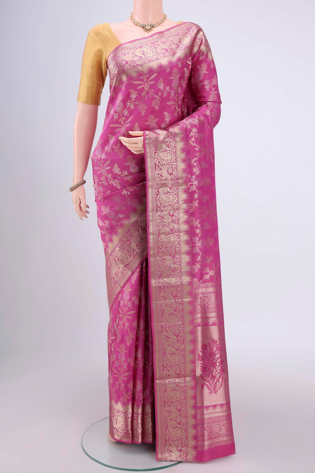 Pink Soft Silk Saree with Zari Brocade on the body and Zari Border.  displayed on a mannequin