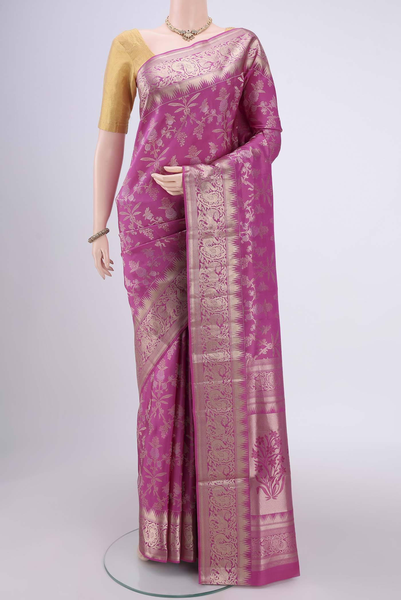 Pink Soft Silk Saree with Zari Brocade on the body and Zari Border.  displayed on a mannequin