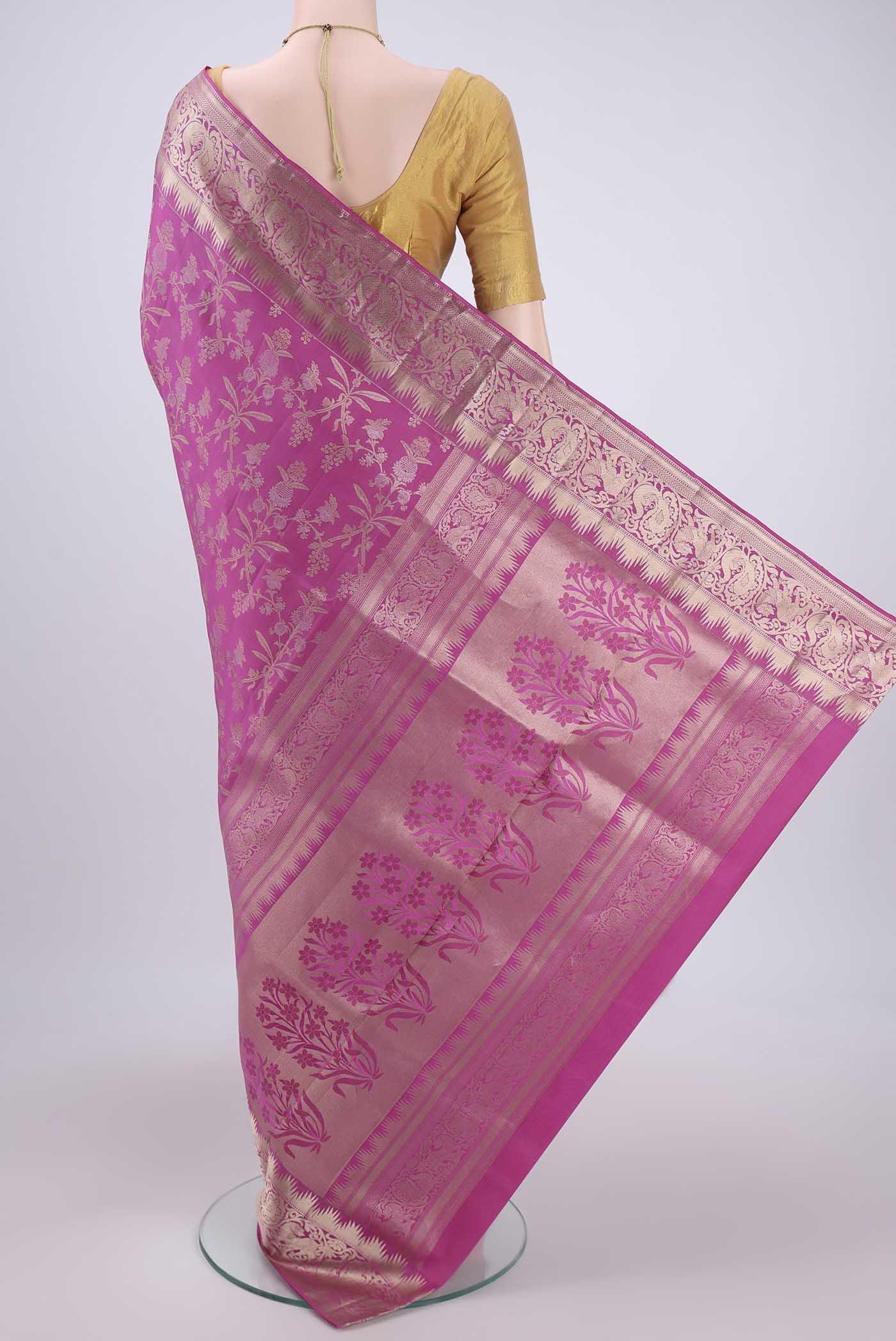 Flat view of Pink Soft Silk Saree with Zari Brocade on the body and Zari Border. 