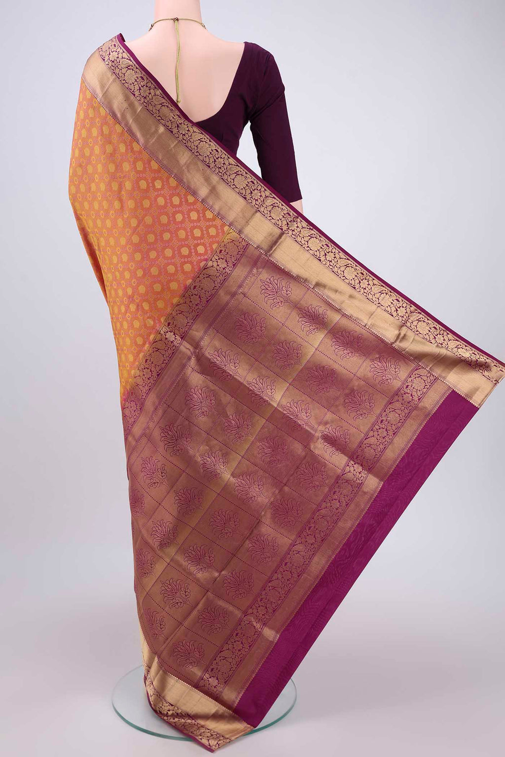 Flat view of Pinkish Yellow Soft Silk Saree with Zari Brocade on the body and Zari Border. 