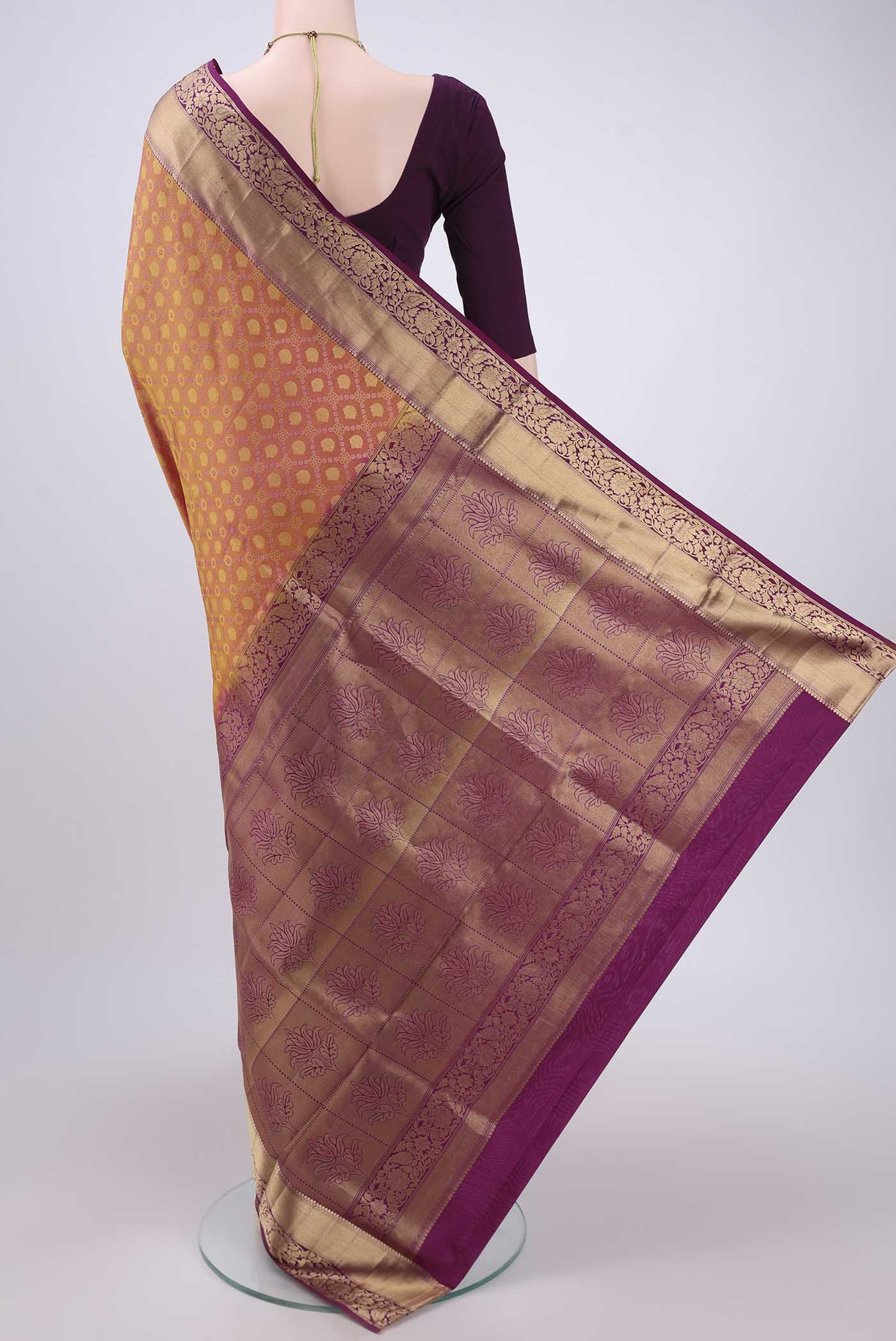 Flat view of Pinkish Yellow Soft Silk Saree with Zari Brocade on the body and Zari Border. 