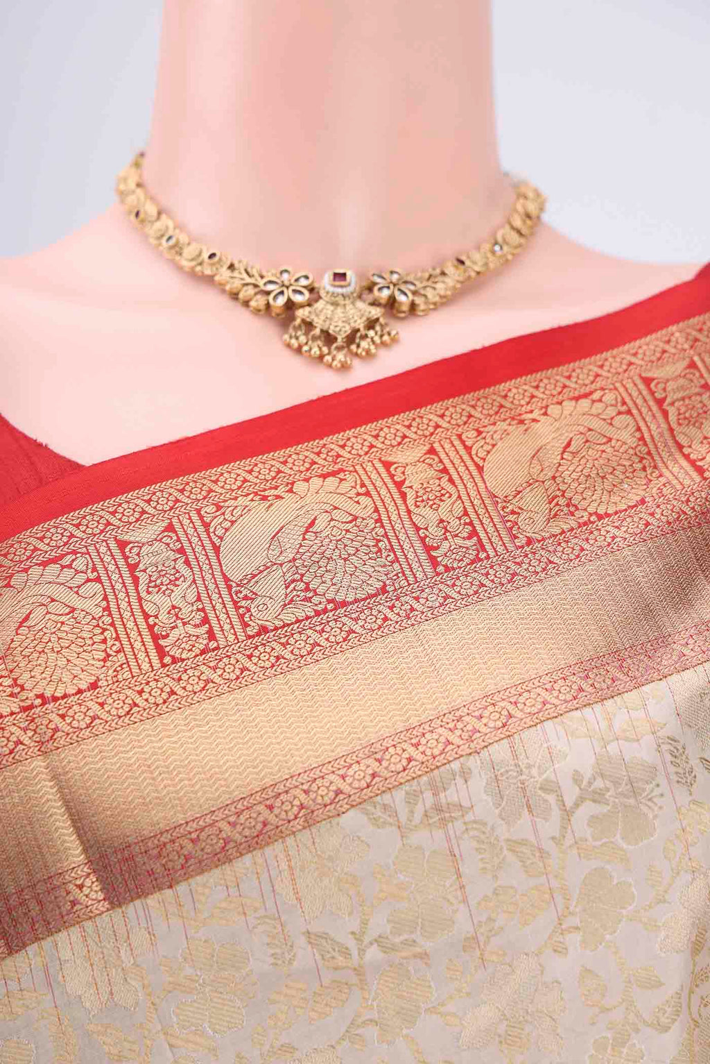 Border image of Off White Soft Silk Saree with Zari Brocade on the body and Zari Border. 