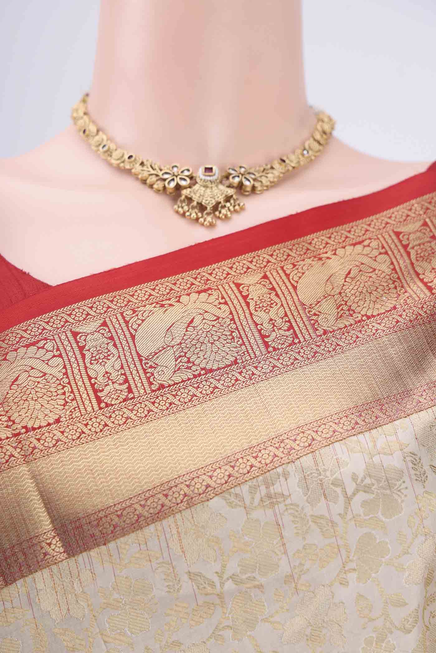 Border image of Off White Soft Silk Saree with Zari Brocade on the body and Zari Border. 