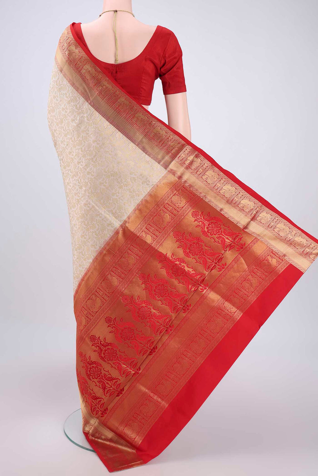 Flat view of Off White Soft Silk Saree with Zari Brocade on the body and Zari Border. 