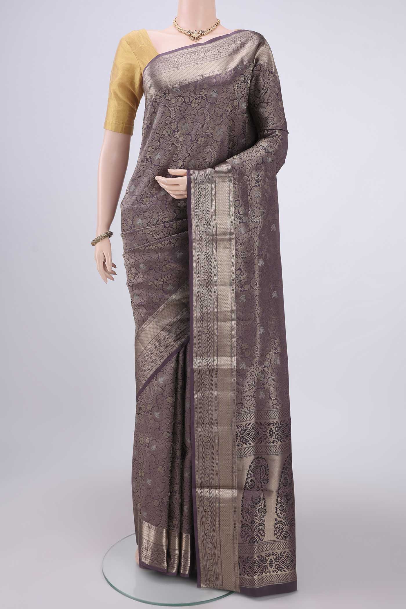 Burgundy Soft Silk Saree with Zari Brocade on the body and Zari Border.  displayed on a mannequin