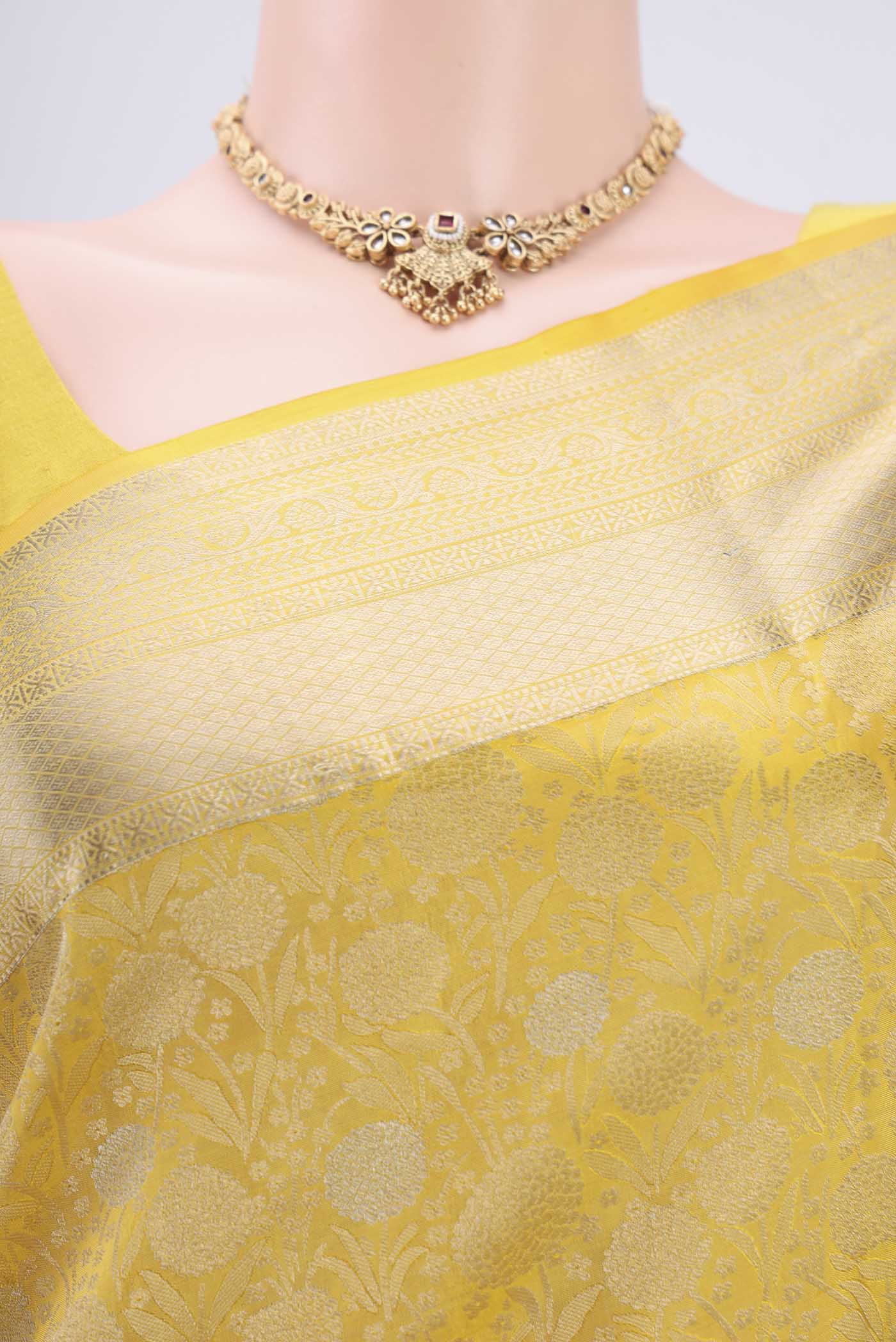 Border image of Lemon Yellow Soft Silk Saree with Zari Brocade on the body and Zari Border. 
