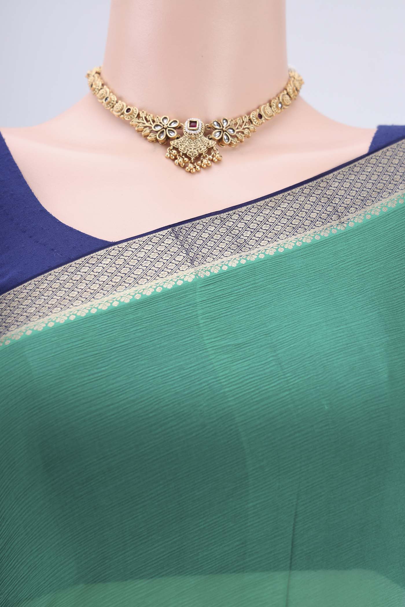 Border image of Sea Green Dual Tone Mysore Chiffon Saree with Plain Body and Zari Border. 