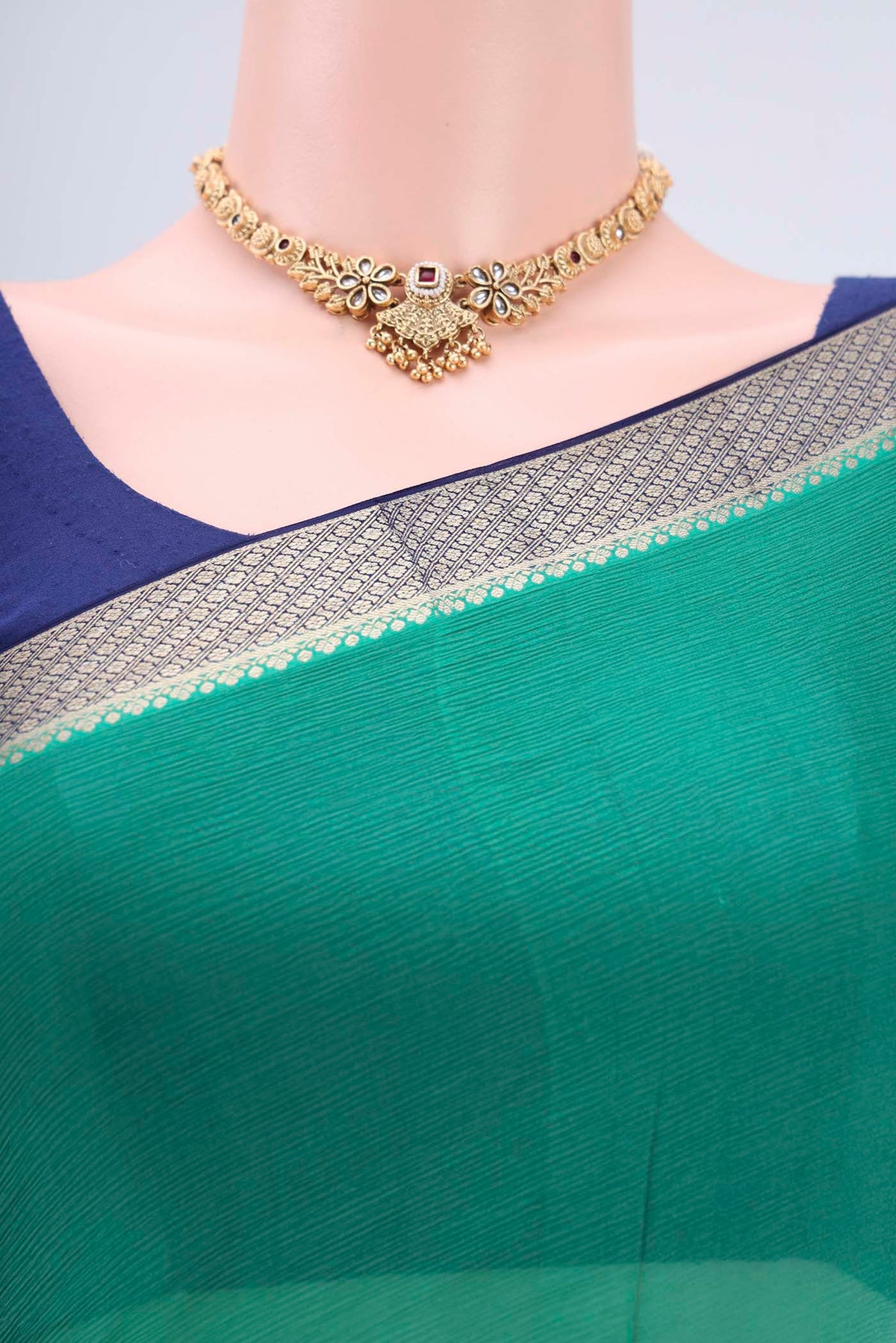 Border image of Sea Green Dual Tone Mysore Chiffon Saree with Plain Body and Zari Border. 