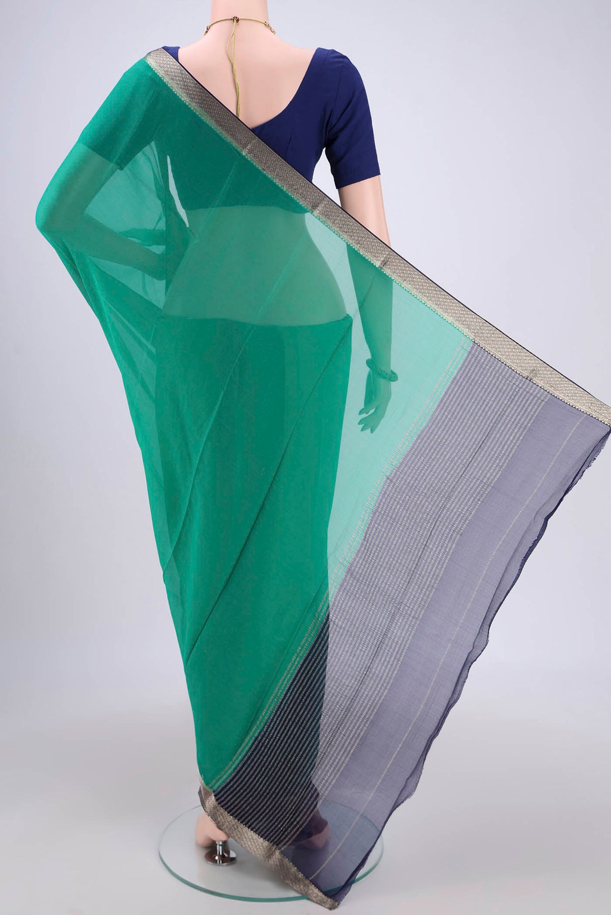 Flat view of Sea Green Dual Tone Mysore Chiffon Saree with Plain Body and Zari Border. 
