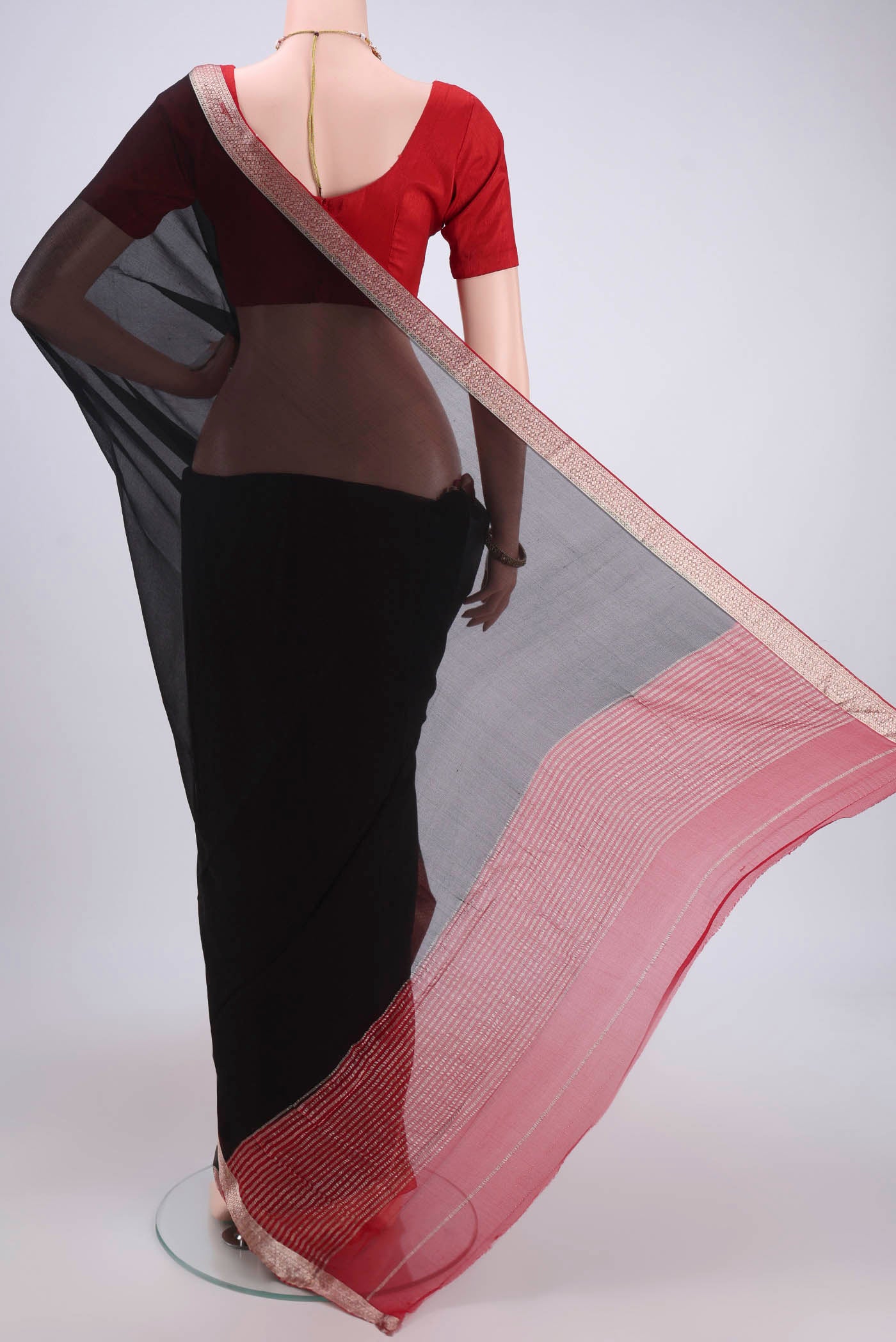 Flat view of Black Dual Tone Mysore Chiffon Saree with Plain Body and Zari Border. 
