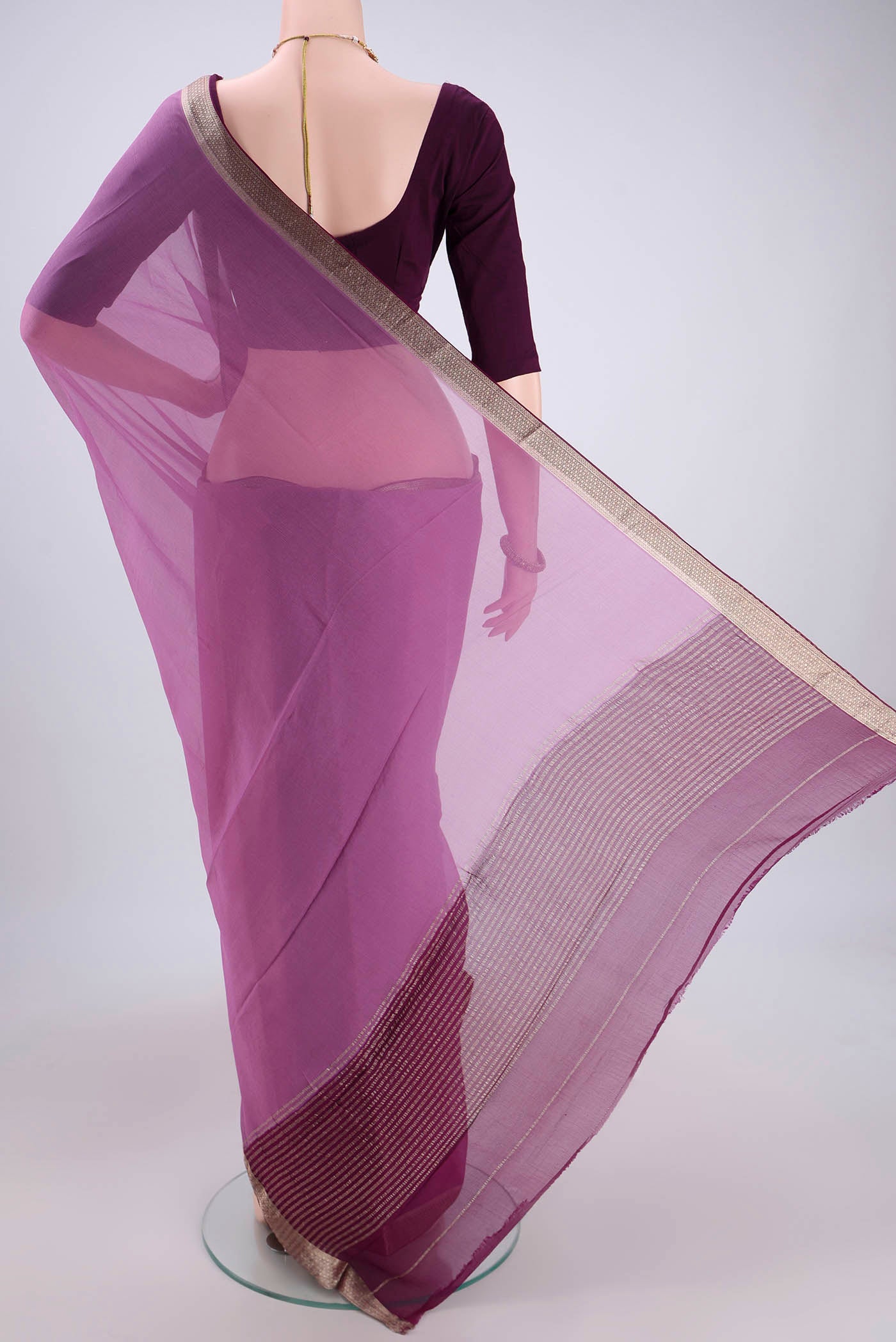 Flat view of Mauve Dual Tone Chiffon Saree with Plain Body and Zari Border. 
