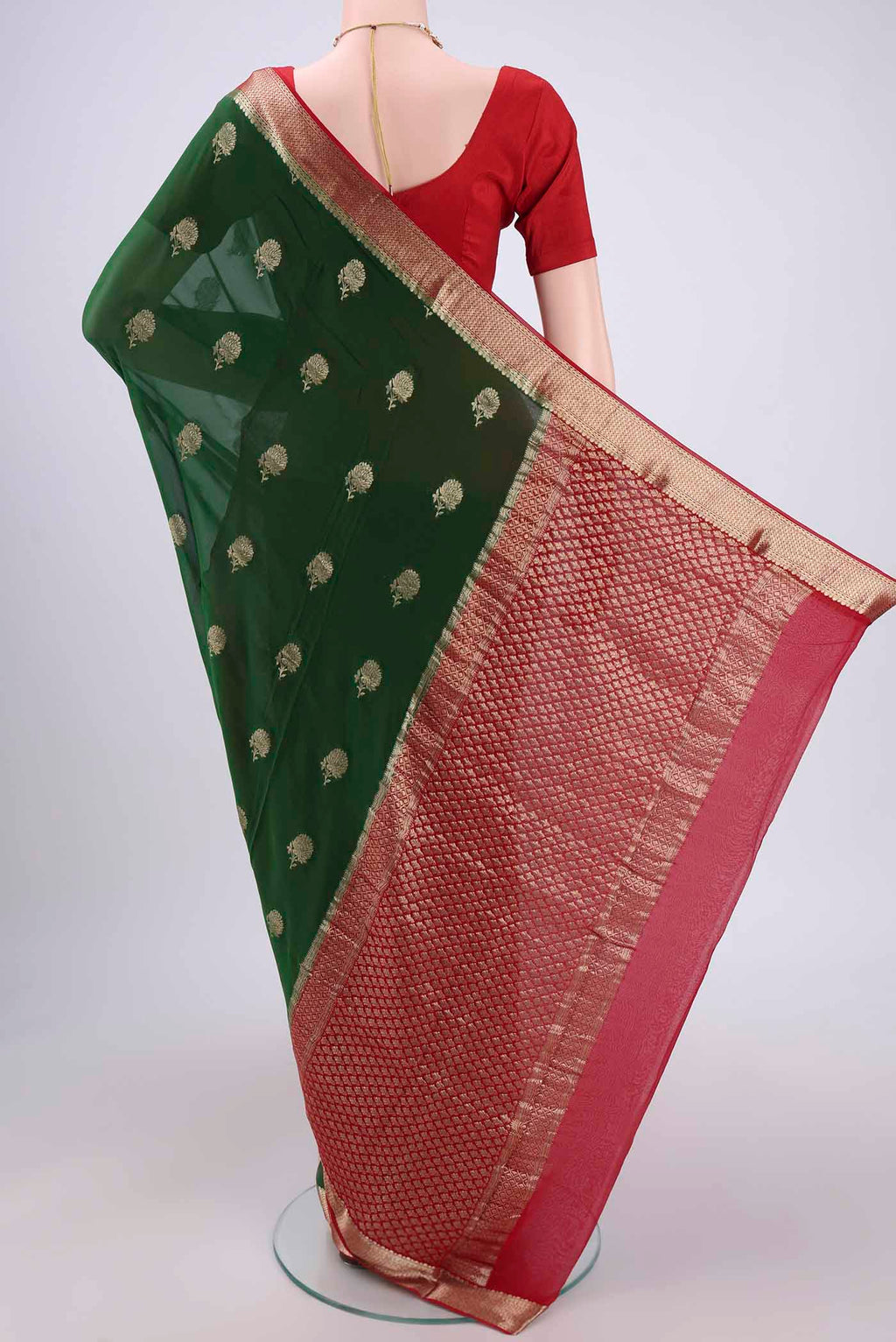 Flat view of Green Dual Tone Mysore Georgette Saree with Zari Butta on the body and Zari Border. 
