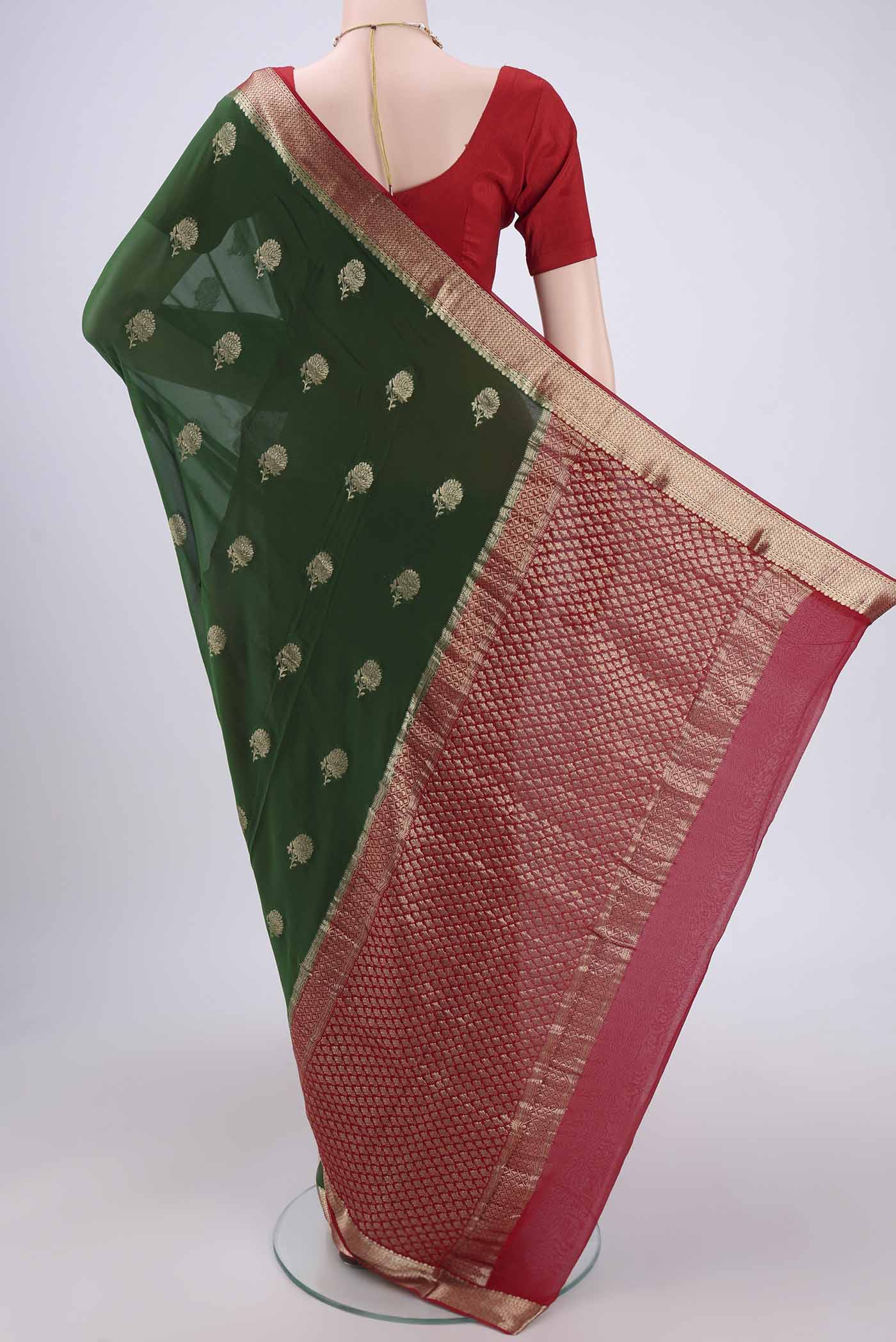 Flat view of Green Dual Tone Mysore Georgette Saree with Zari Butta on the body and Zari Border. 