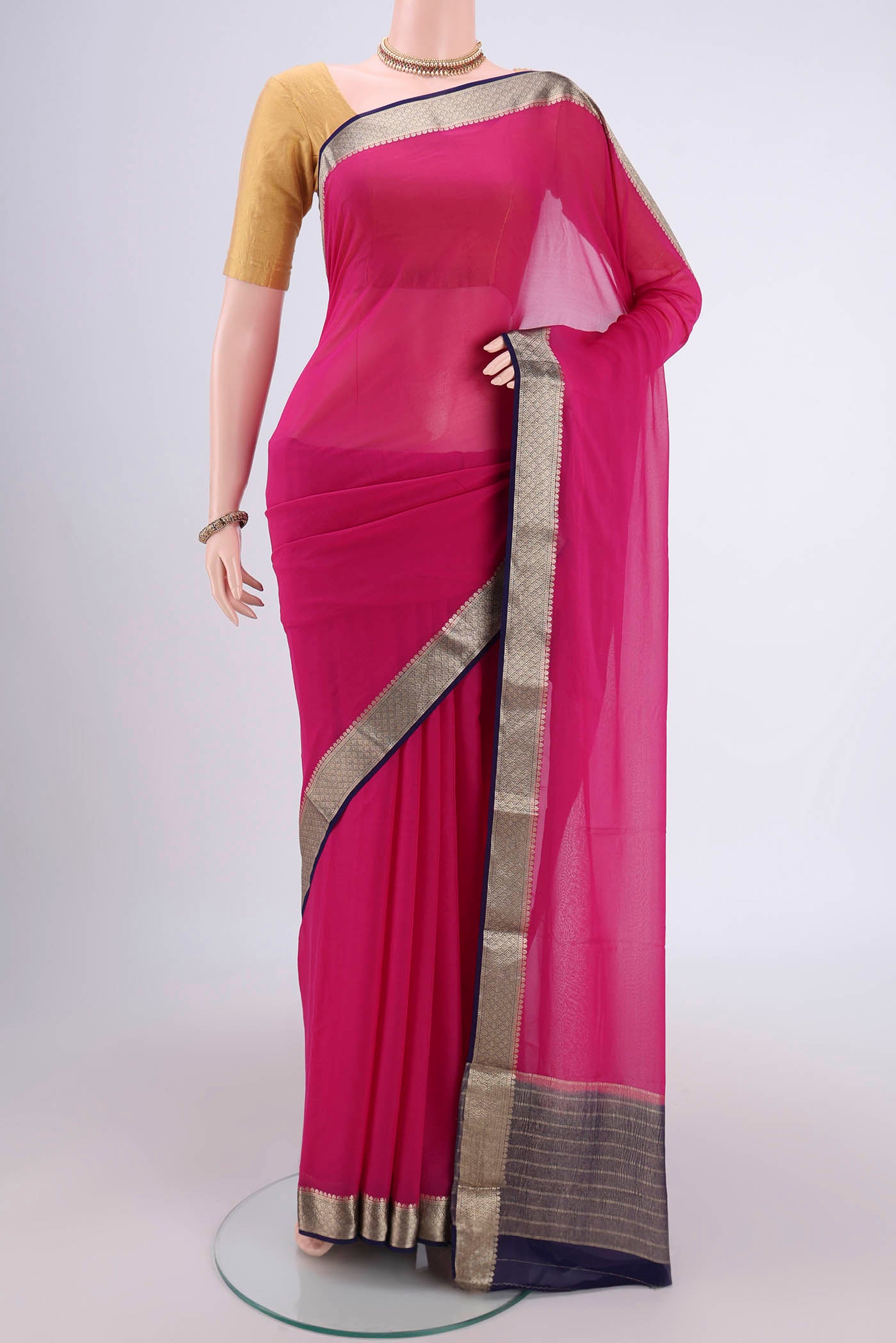 Pink Dual Tone Mysore Georgette Saree with Plain Body and Zari Border.  displayed on a mannequin