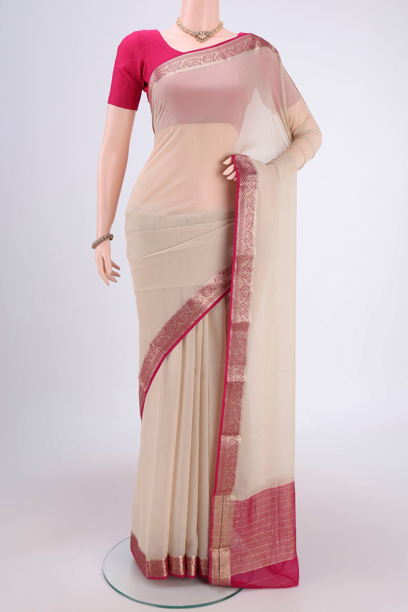 Cream Dual Tone Mysore Georgette Saree with Plain Body and Zari Border.  displayed on a mannequin