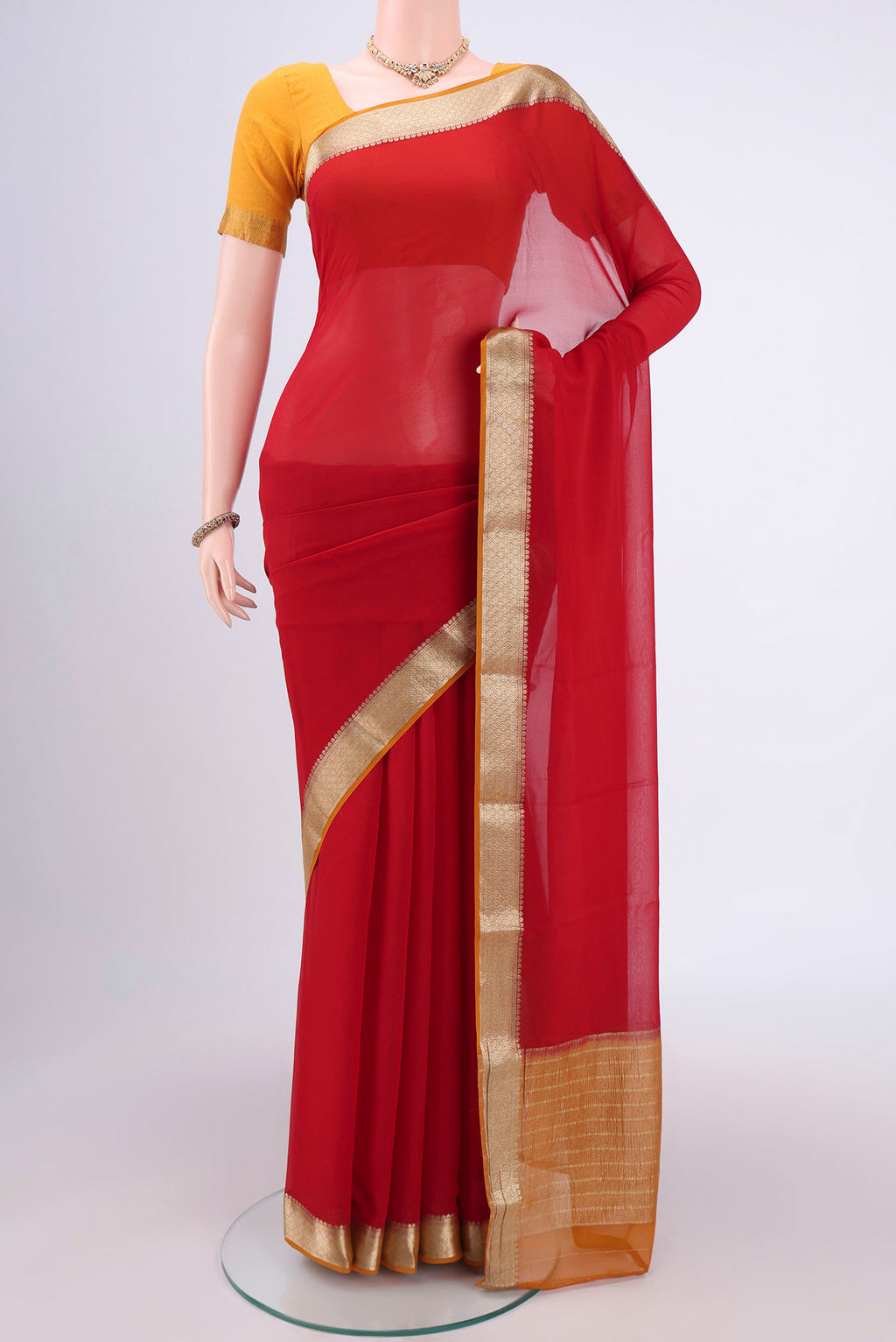 Deep Red Dual Tone Mysore Georgette Saree with Plain Body and Zari Border.  displayed on a mannequin