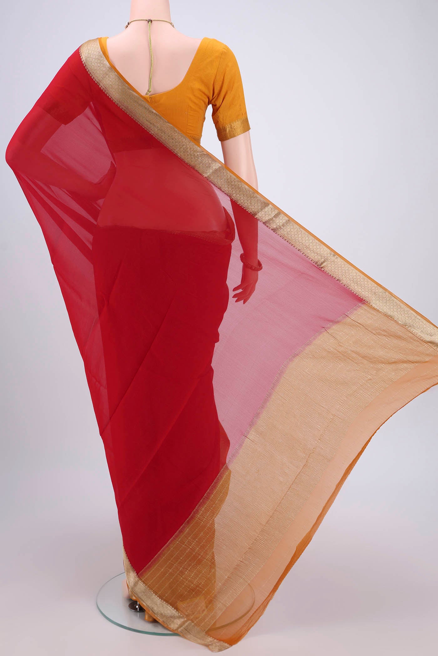 Flat view of Deep Red Dual Tone Mysore Georgette Saree with Plain Body and Zari Border. 