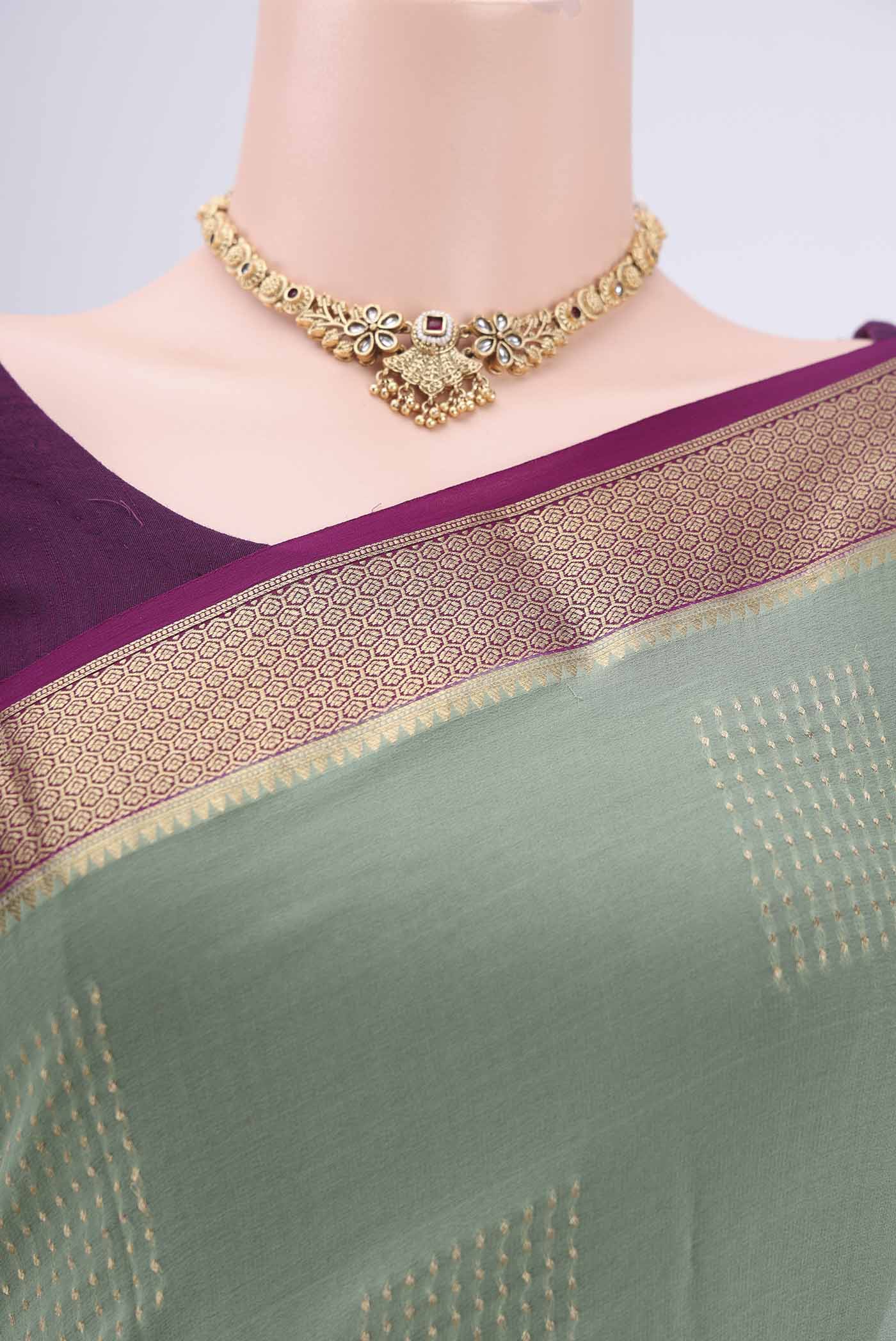 Border image of Pista Green Georgette Saree with Zari Butta on the body and Zari Border. 