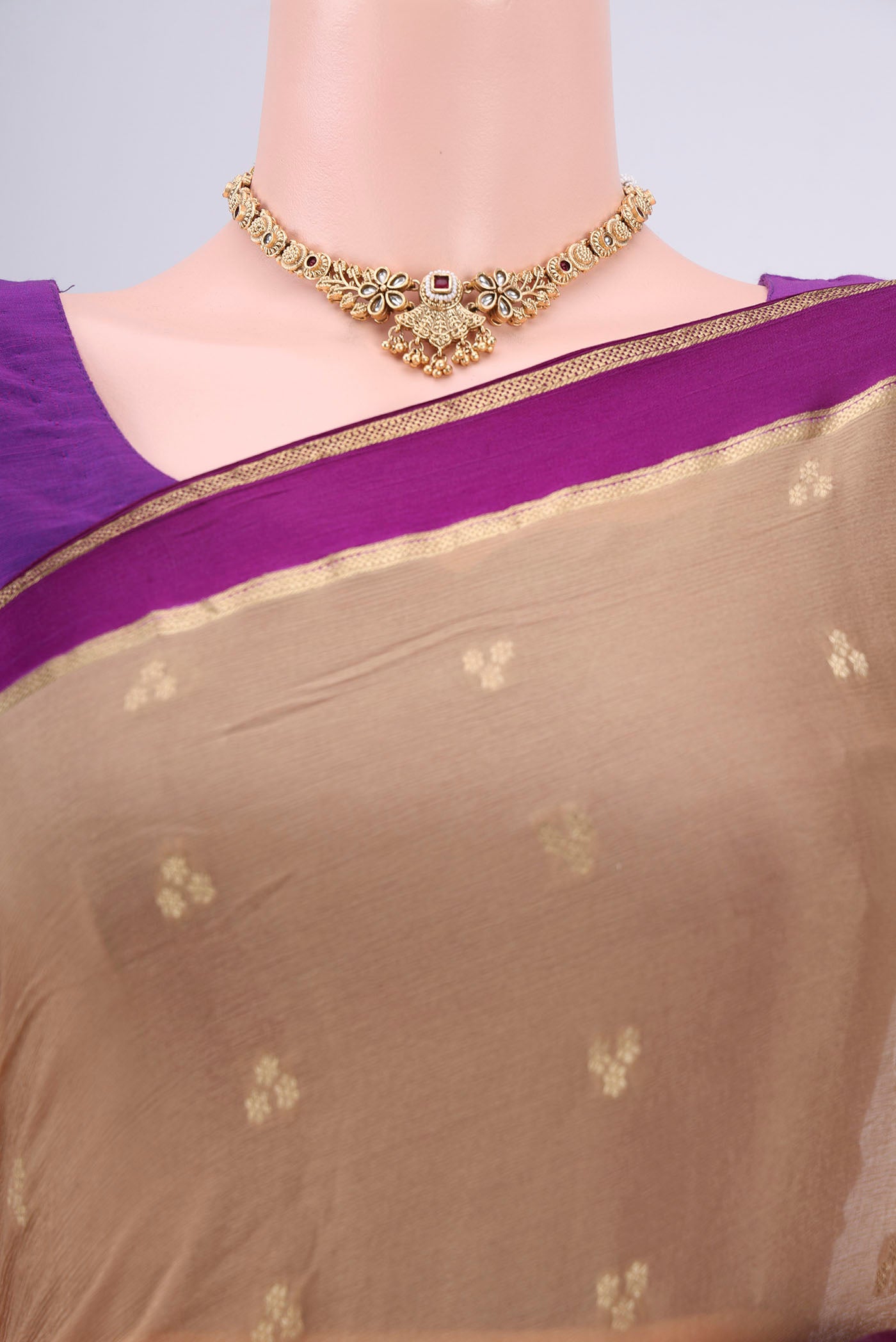 Border image of Dark Beige Mysore Chiffon Saree with Zari Butta on the body and Zari Border. 
