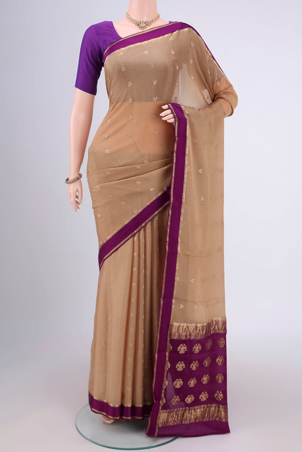 Dark Beige Mysore Chiffon Saree with Zari Butta on the body and Zari Border.  displayed on a mannequin