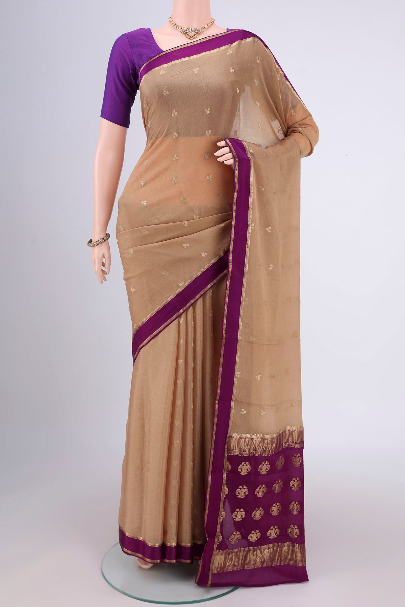 Dark Beige Mysore Chiffon Saree with Zari Butta on the body and Zari Border.  displayed on a mannequin