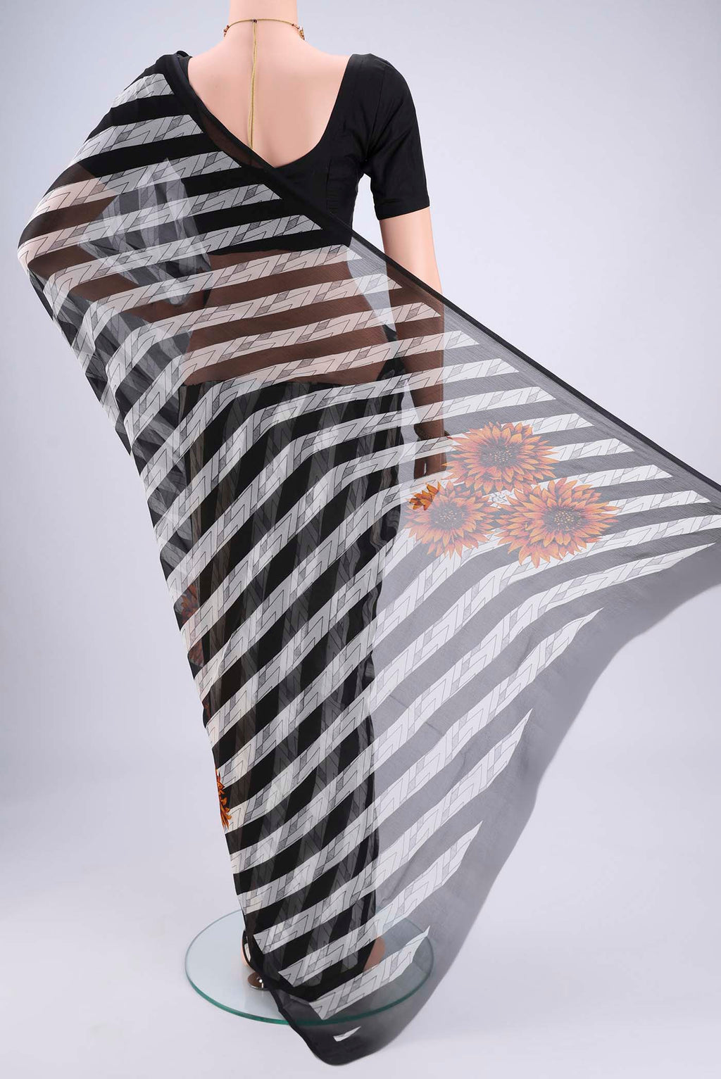 Flat view of Black Mysore Chiffon Saree with Zig Zag design on the body and Plain Border. 