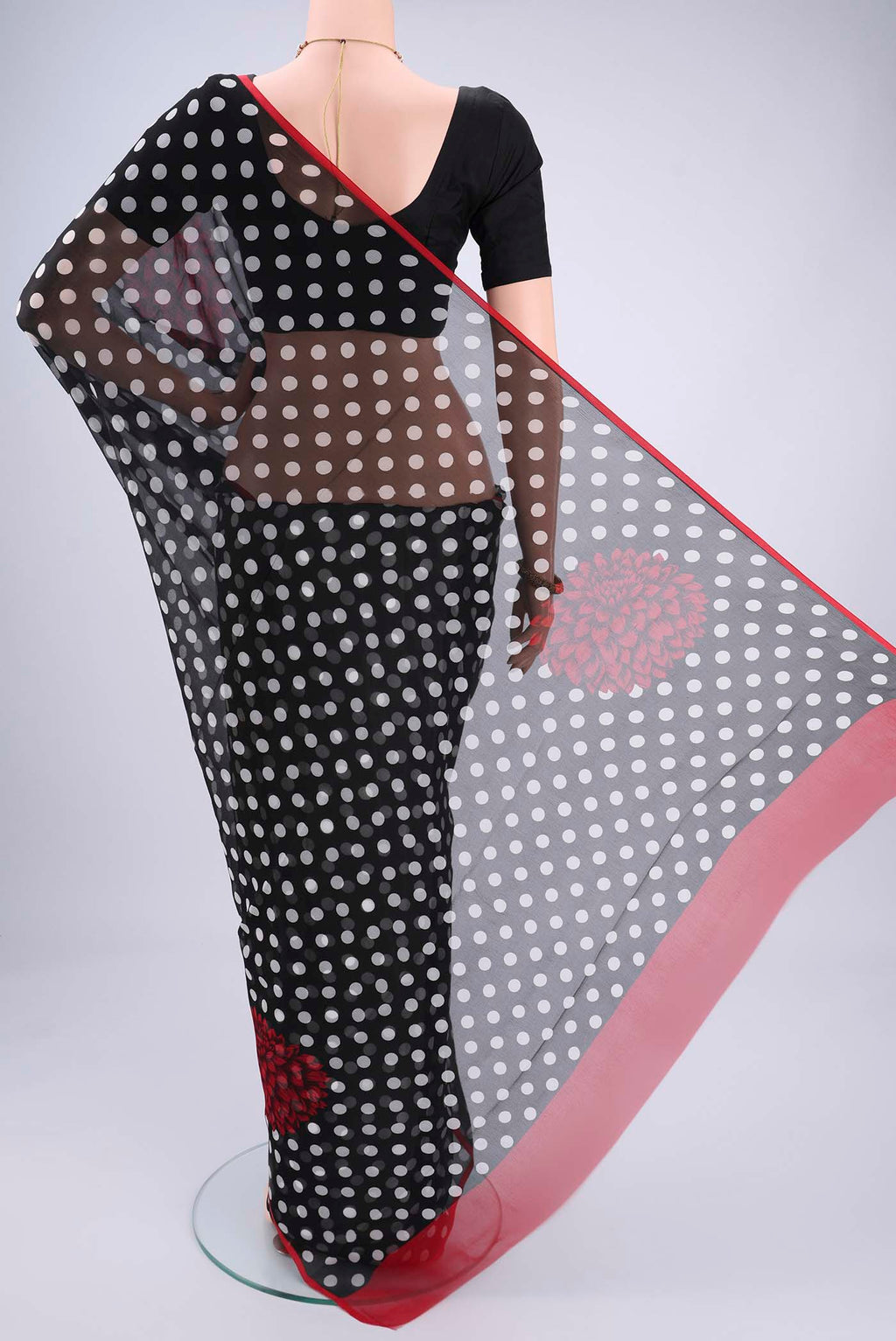 Flat view of Black Mysore Chiffon Saree with Polka Dots on the body and Plain Border. 