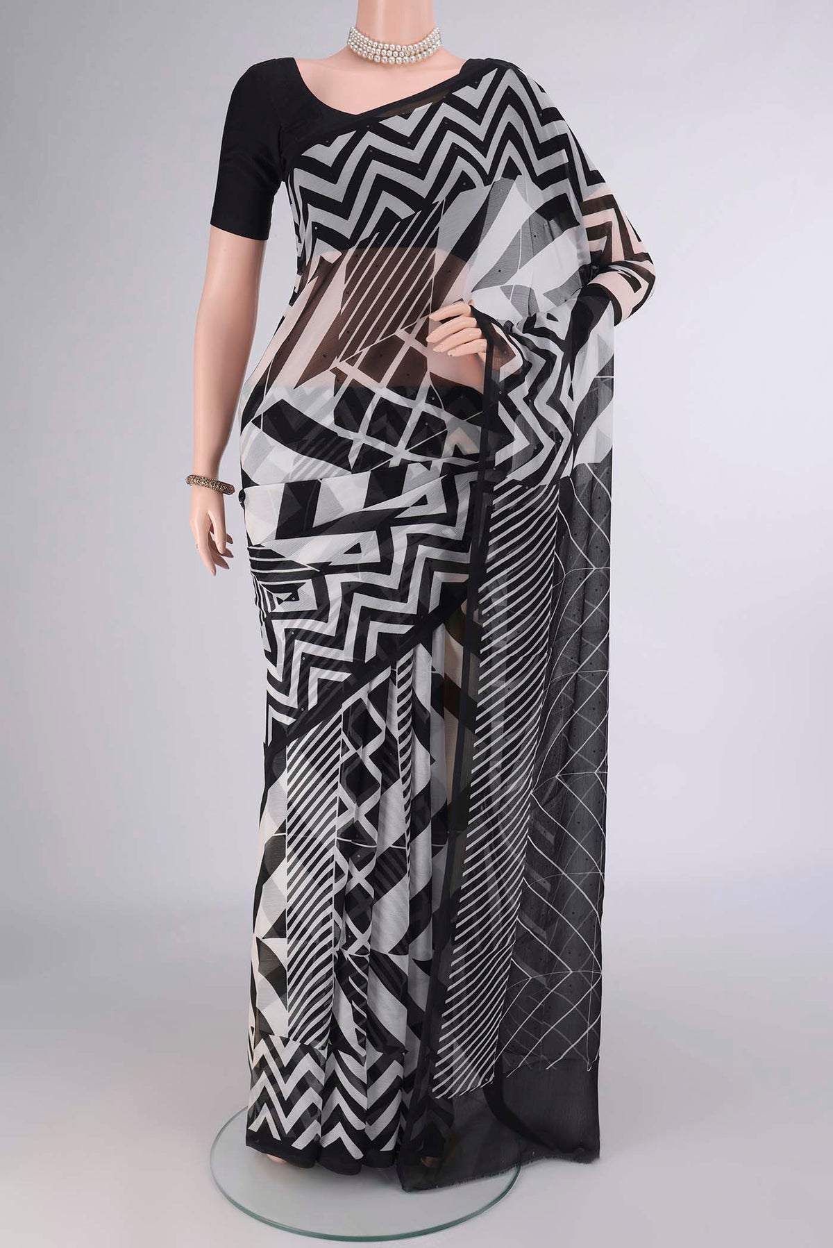 Black Mysore Chiffon Saree with Printed design on the body and Without Border.  displayed on a mannequin