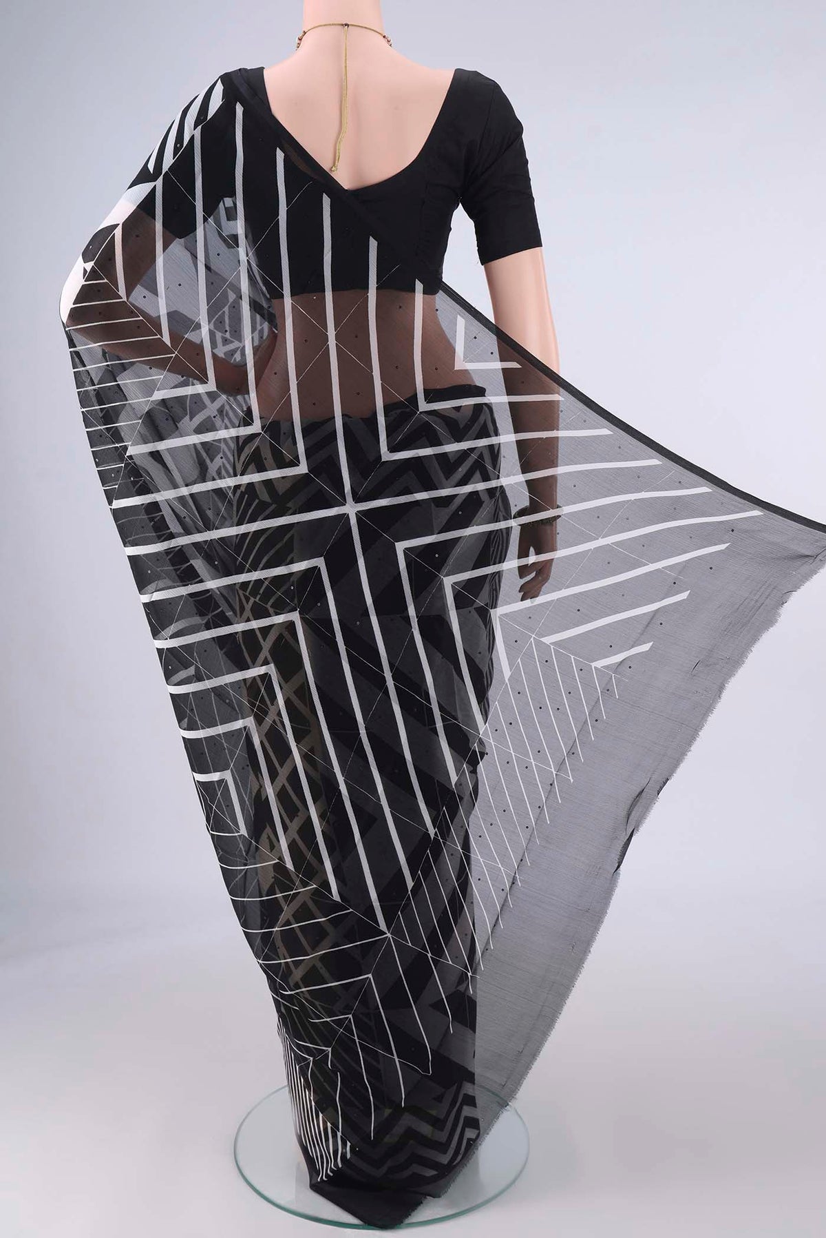 Flat view of Black Mysore Chiffon Saree with Printed design on the body and Without Border. 